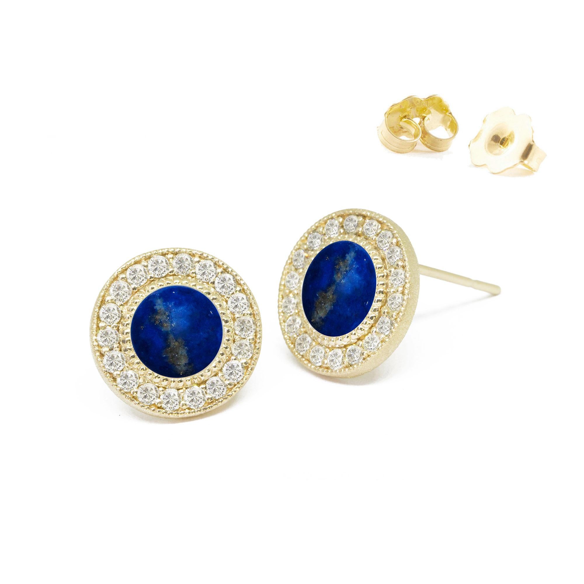 Designed with concentric circles of engraved gold and pavé diamonds surrounding lapis cabochons, the Diamond Orbit Gold Studs elevate everyday looks with a cool mix of textures and lusters.

Nina Nguyen Design's patent-pending earrings have an