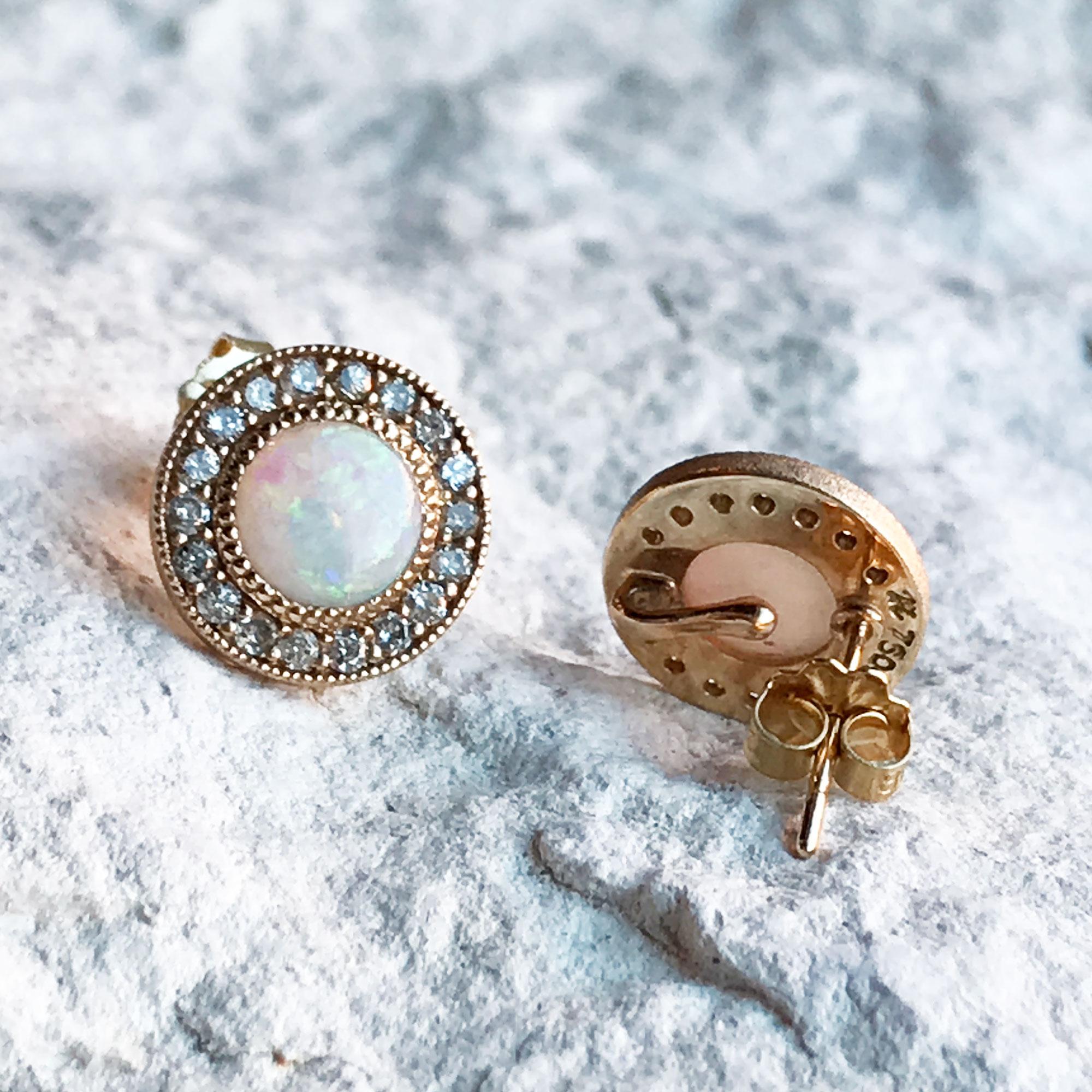 Designed with concentric circles of engraved gold and pavé diamonds surrounding white opal cabochons, the Diamond Orbit Gold Studs elevate everyday looks with a cool mix of textures and lusters.

Nina Nguyen Design's patent-pending earrings have an