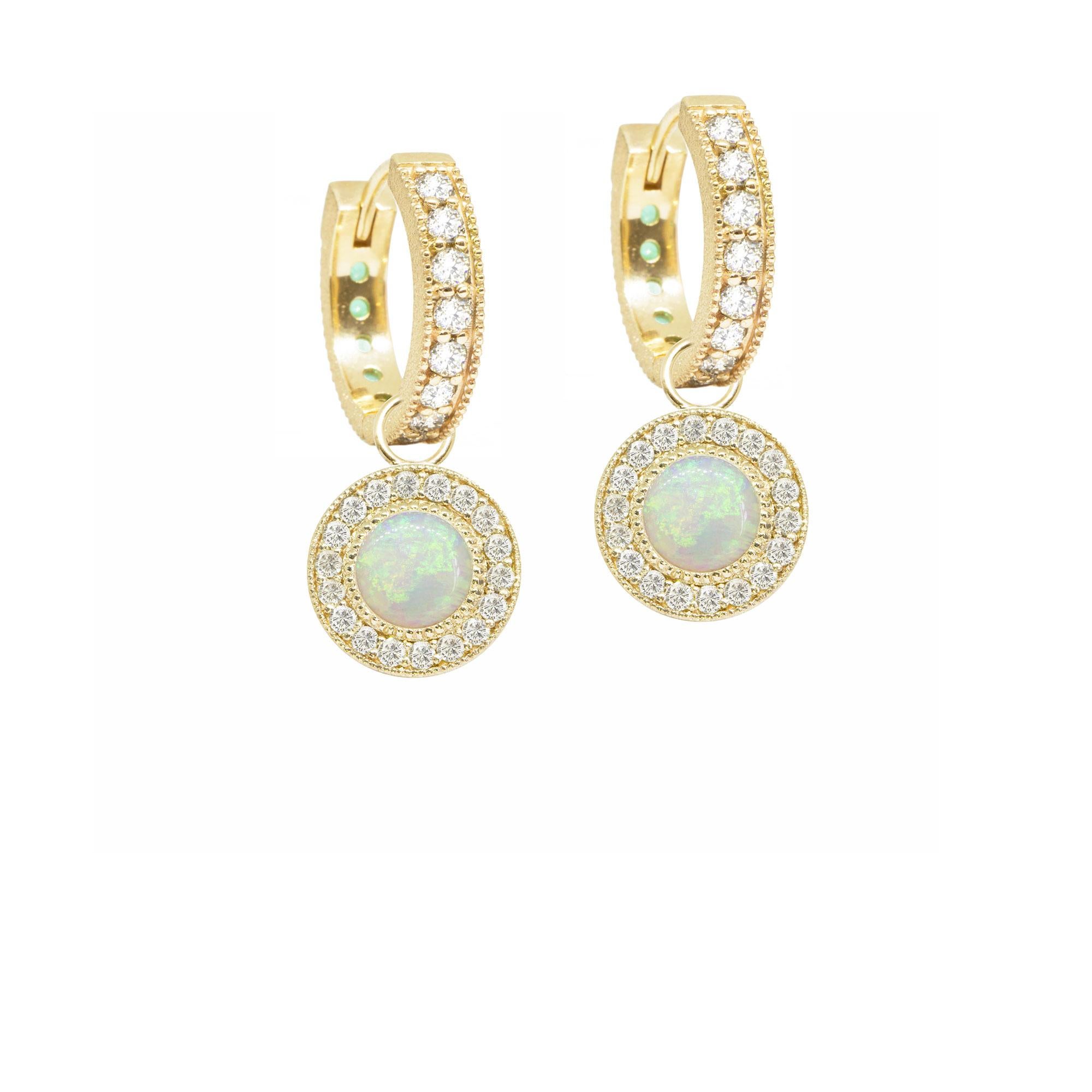 In the Diamond Orbit Gold Charms, concentric circles of engraved gold and pavé diamonds surround white opal cabochons for a cool mix of textures and lusters. They pair with any of our hoops and mix well with other styles.

Nina Nguyen Design's
