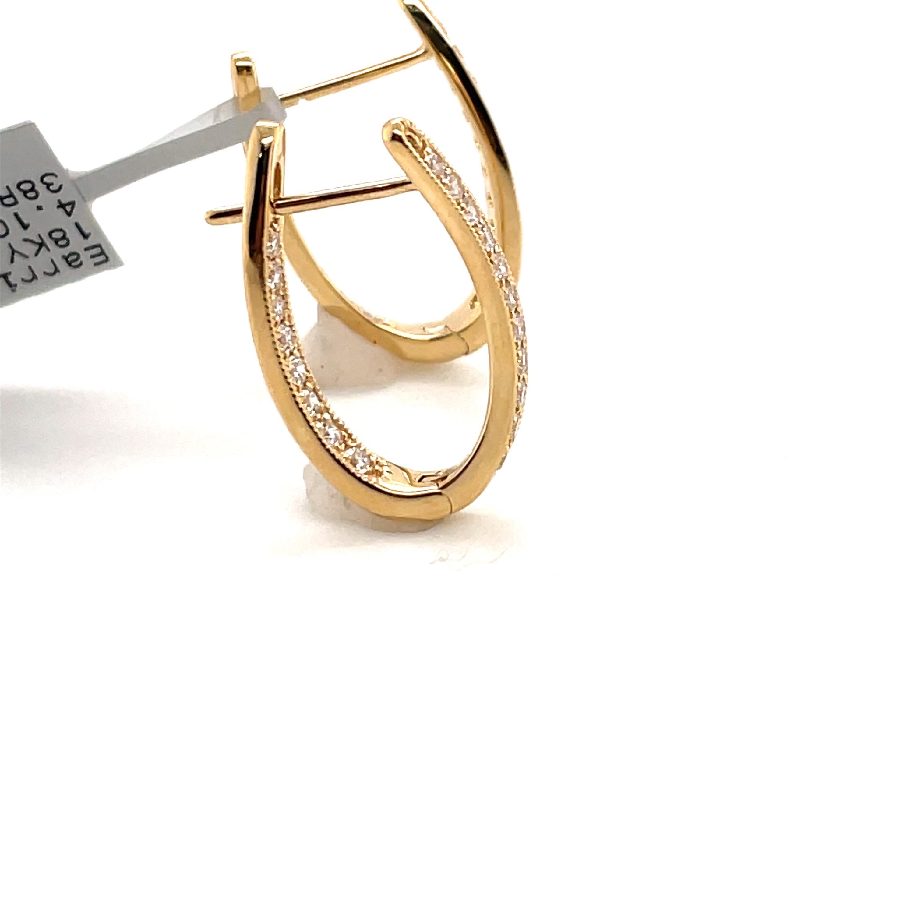 Contemporary Diamond Oval Shape Twist Hoop Earrings 0.61 Carat 18 Karat Yellow Gold For Sale