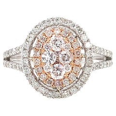 Diamond oval shaped halo engagement ring 18k white and rose gold