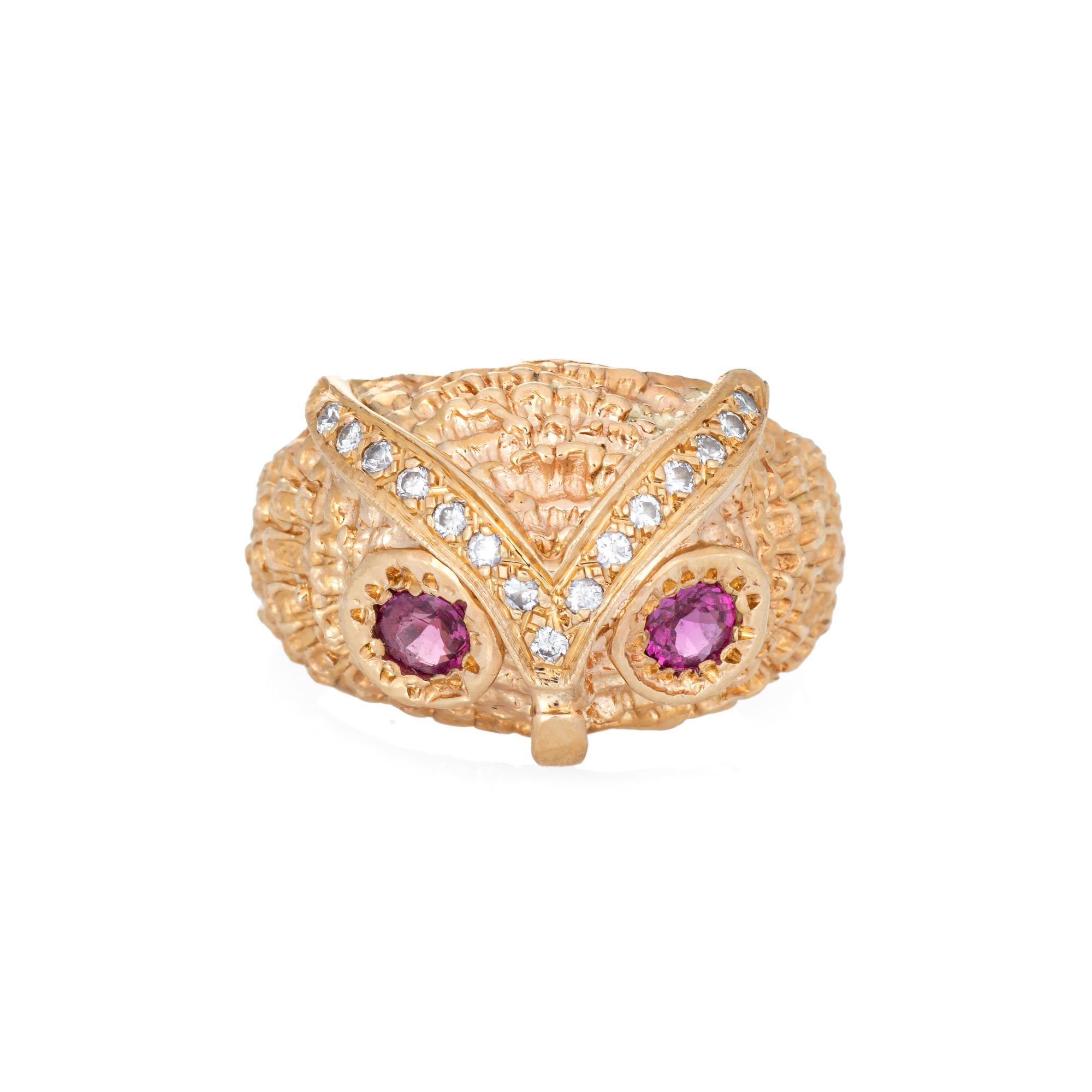 Stylish diamond owl ring set with ruby eyes, crafted in 14 karat yellow gold. 

Diamonds total an estimated 0.08 carats (estimated at H-I color and VS2-I1 clarity). Two rubies measure approx. 3mm. The rubies are in very good condition and free of