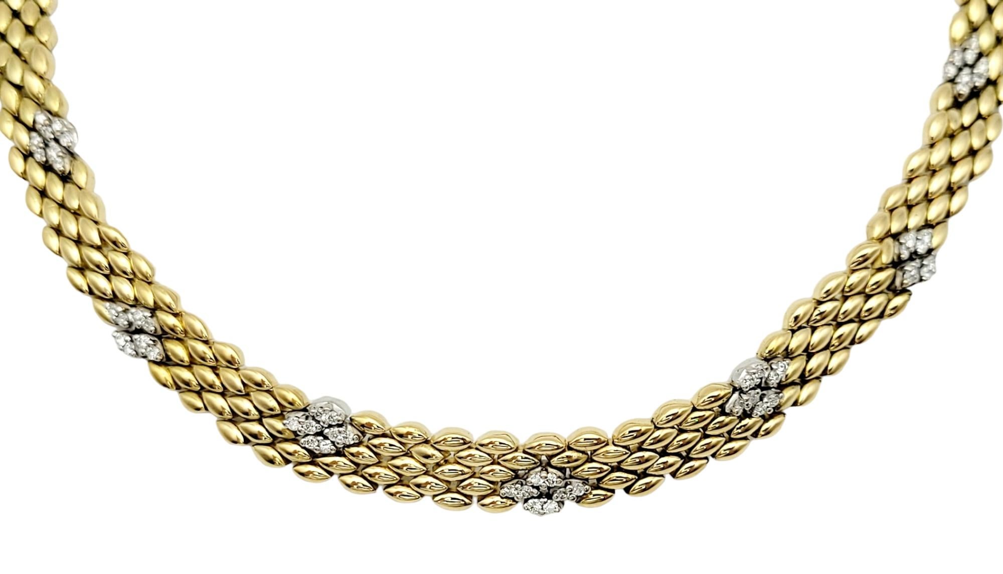 Incredibly stunning diamond and gold panther link necklace. This beautiful necklace features 52 diamonds throughout the chain. The diamonds are round and brilliant, G-H in color and SI-1 to SI-2 in clarity. The total carat weight of diamonds is 0.75