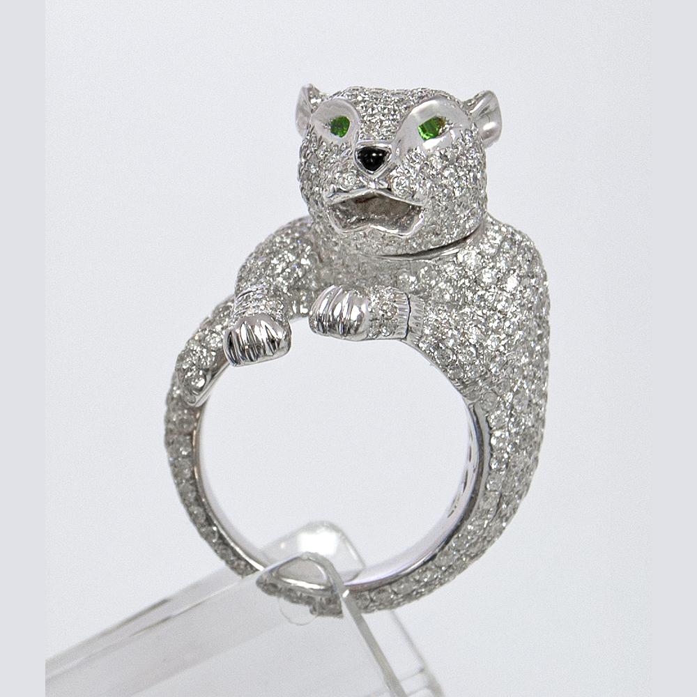 The panther is symbol of fierceness, playfulness and lovableness. Get noticed with this beautiful panther ring crafted with 5.90 carats of white diamonds. Eyes are green tsavorite stones (.04 carats) and the nose is black onyx, beautifully created