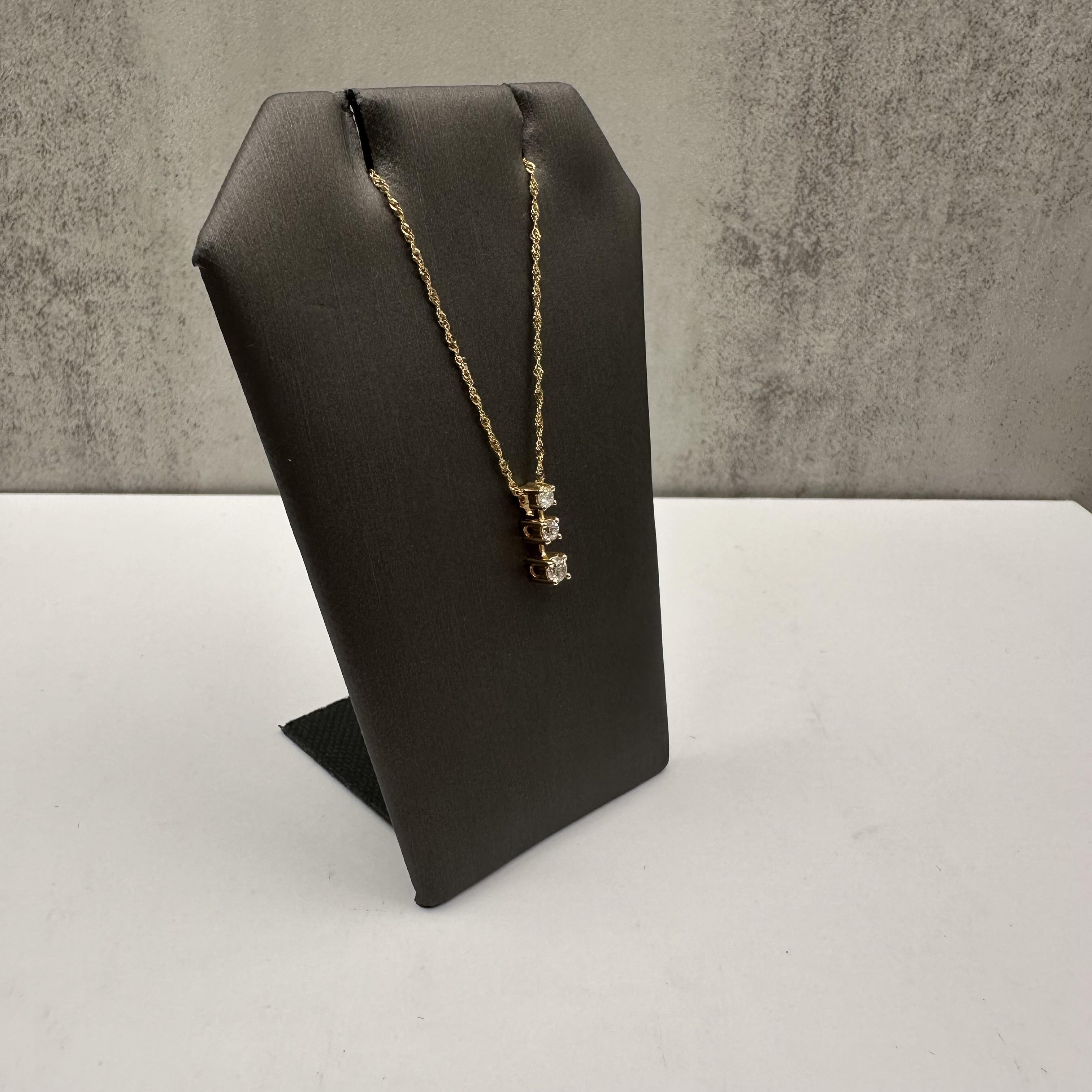 Celebrate meaningful moments with this elegant Diamond Past, Present, Future Necklace, crafted in 10kt Yellow Gold. Featuring 0.20 carat total weight (ctw) of natural GH color, SI clarity round diamonds, this necklace symbolizes your journey through