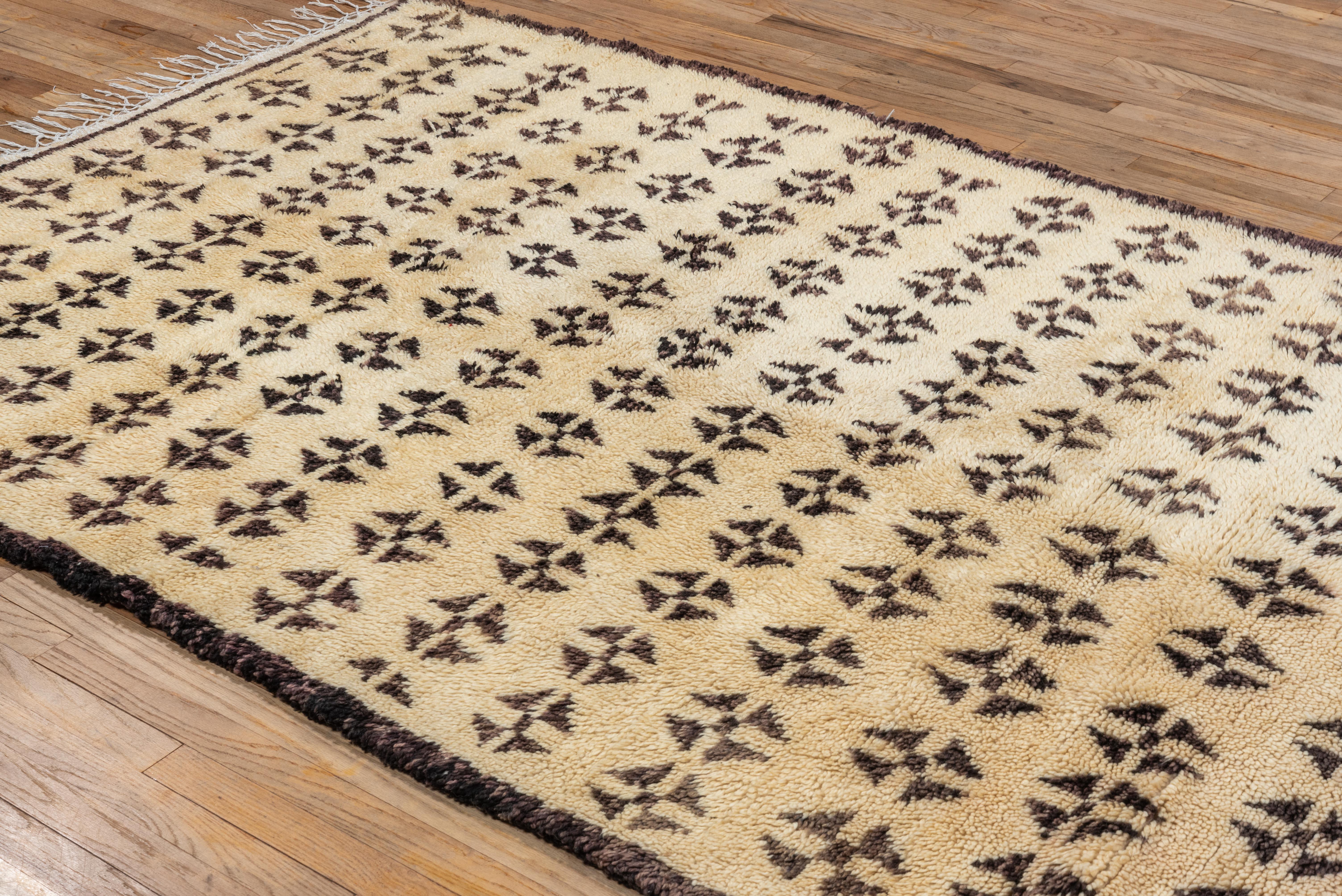 This rug features repeating floral/diamond shaped symbols - a wonderful, minimalist piece that also makes a statement. 
Please inquire with any questions - we'd love to answer all of them.