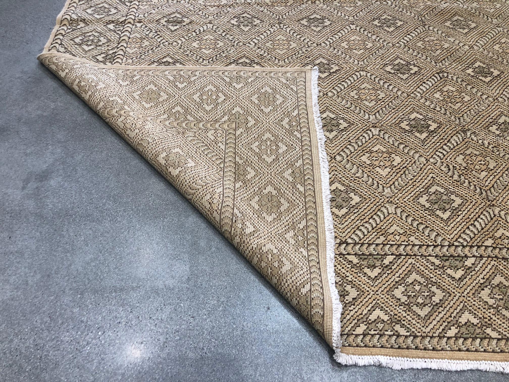 Texture abounds in this stunning wool rug with the look and feel of finely executed needlework. Subtle beige and pastel tones give this rug a versatility advantage that is hard to match. Handmade in Europe.