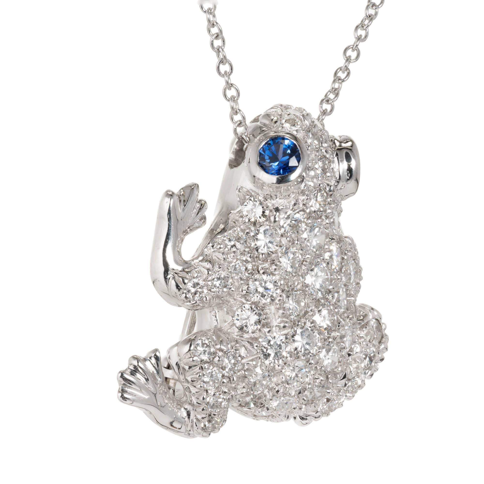 3-D Frog pin pendant in 18k white gold Pavé set with full cut Diamonds very close together. Sapphire eyes, on a 18 inch white gold chain. 

54 round Diamonds, approx. total weight 1.50cts, F, VS
2 round fine blue Sapphires, approx. total weight