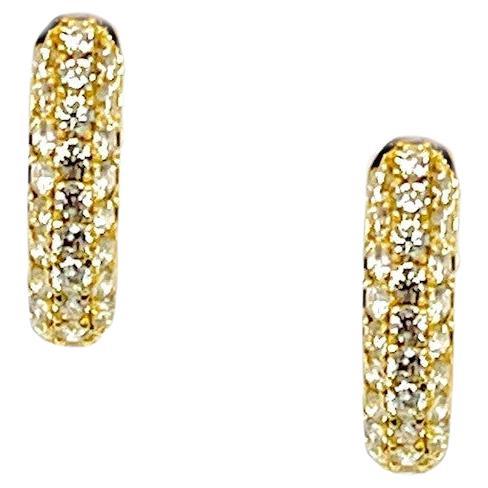 These pretty diamond and 18k yellow gold hoop earrings will make a perfect gift for yourself or a loved one! Three rows of pave-set white brilliant diamonds weighing nearly a half a carat total adorn these lovely hoops, making them sparkle from