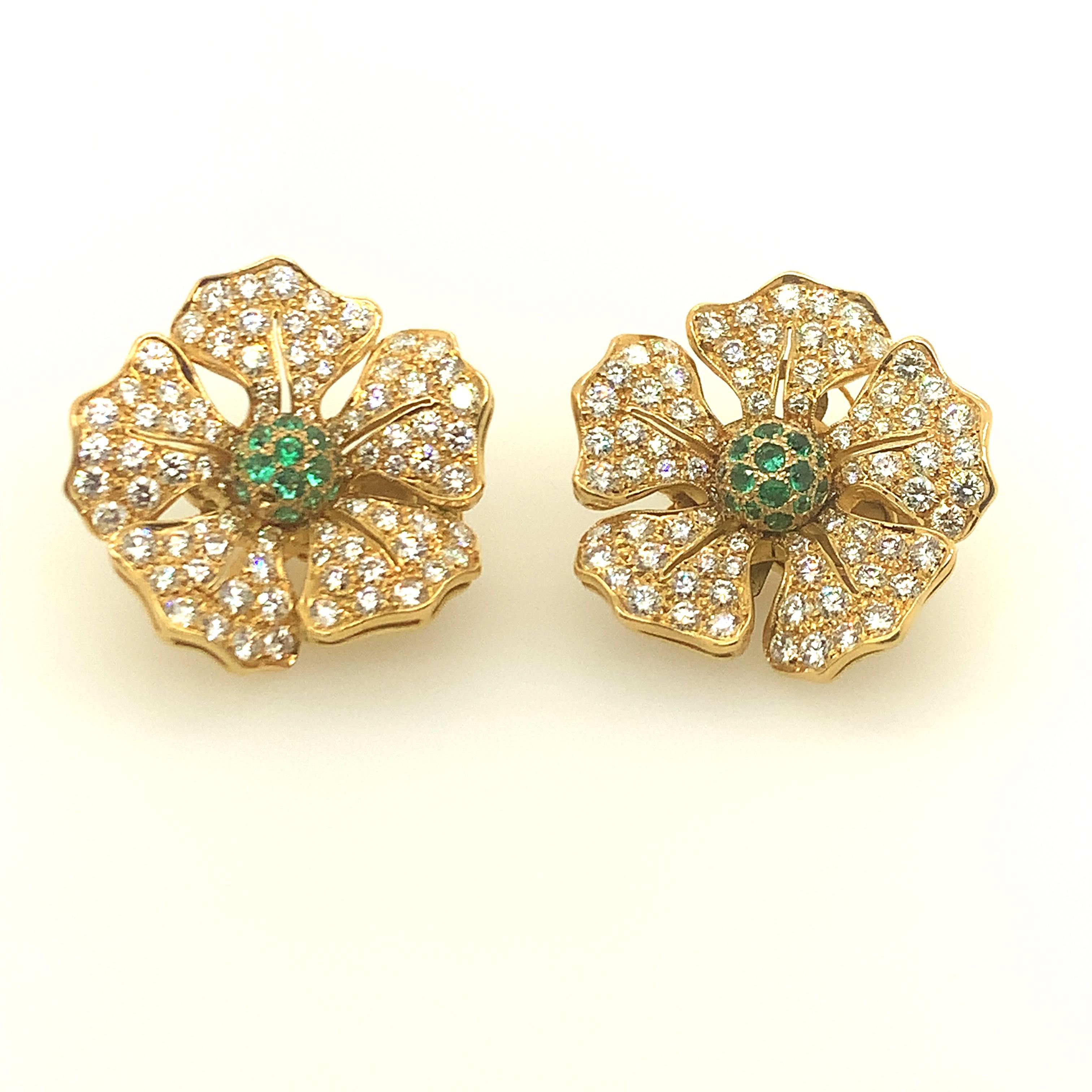 Extraordinary figural flower earrings comprised of brilliant cut diamonds and emeralds meticulously pave set in 18k. Most graceful feminine shape. Approximately 5 cts. of diamonds, .50cts. of vibrant emeralds.  Omega backs, posts can be added