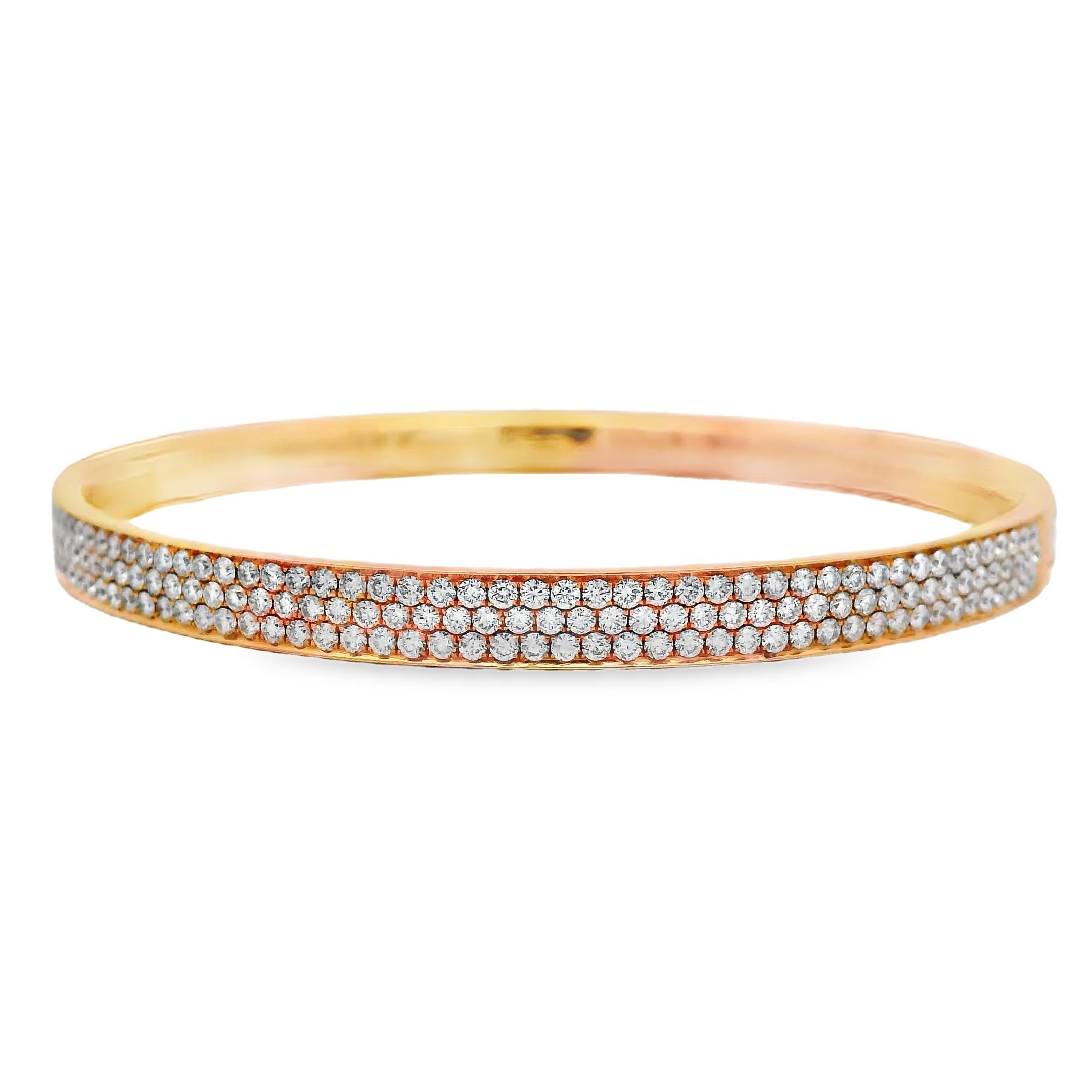 This diamond bangle bracelet is crafted in 18K rose gold and set with 5 carats of natural diamonds across three uniform rows. A total of 347 round brilliant-cut stones are pavé-set across the full face, creating an uninterrupted surface of light and