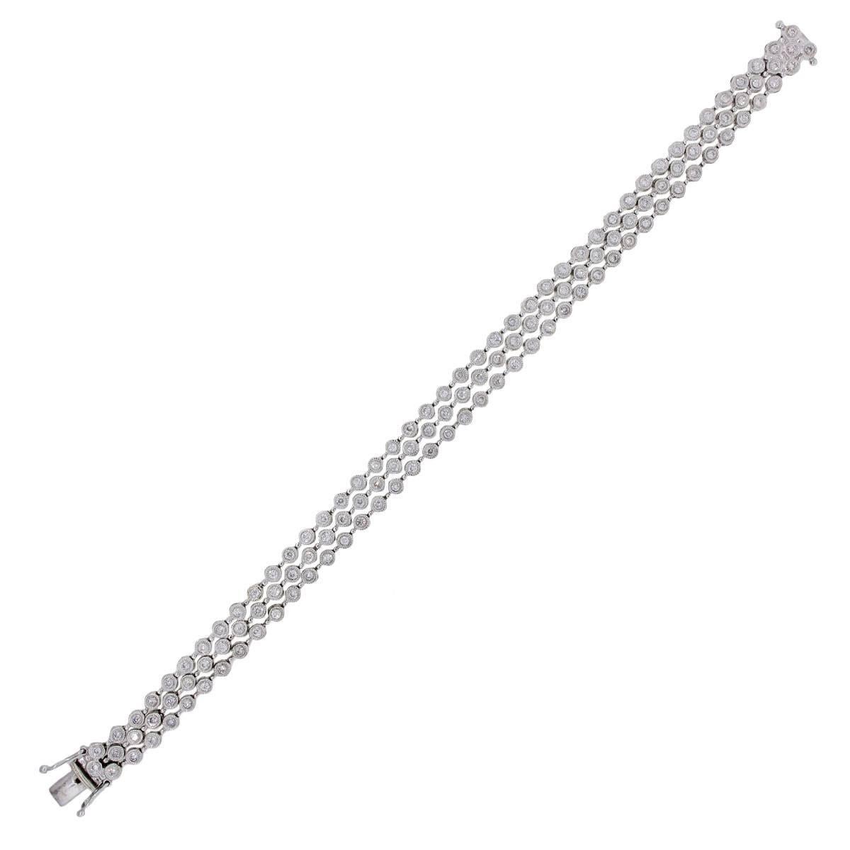 Material: 14k white gold
Diamond Details: Approximately 2ctw of bezel set round brilliant diamonds. Diamonds are I/J in color and SI in clarity
Fastening: Tongue in box clasp with safety latch
Length: 7.25″
Item Weight: 16.9g (10.8dwt)
Additional