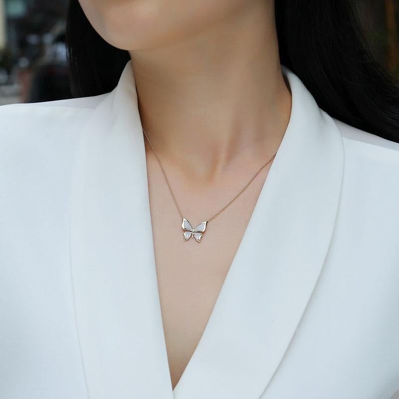 The Diamond Pave Butterfly 14K Yellow Gold Pendant Necklace is a captivating piece of jewelry that combines the elegance of full cut diamonds with the timeless beauty of a butterfly design. Set in 14K yellow gold, this necklace exudes grace and