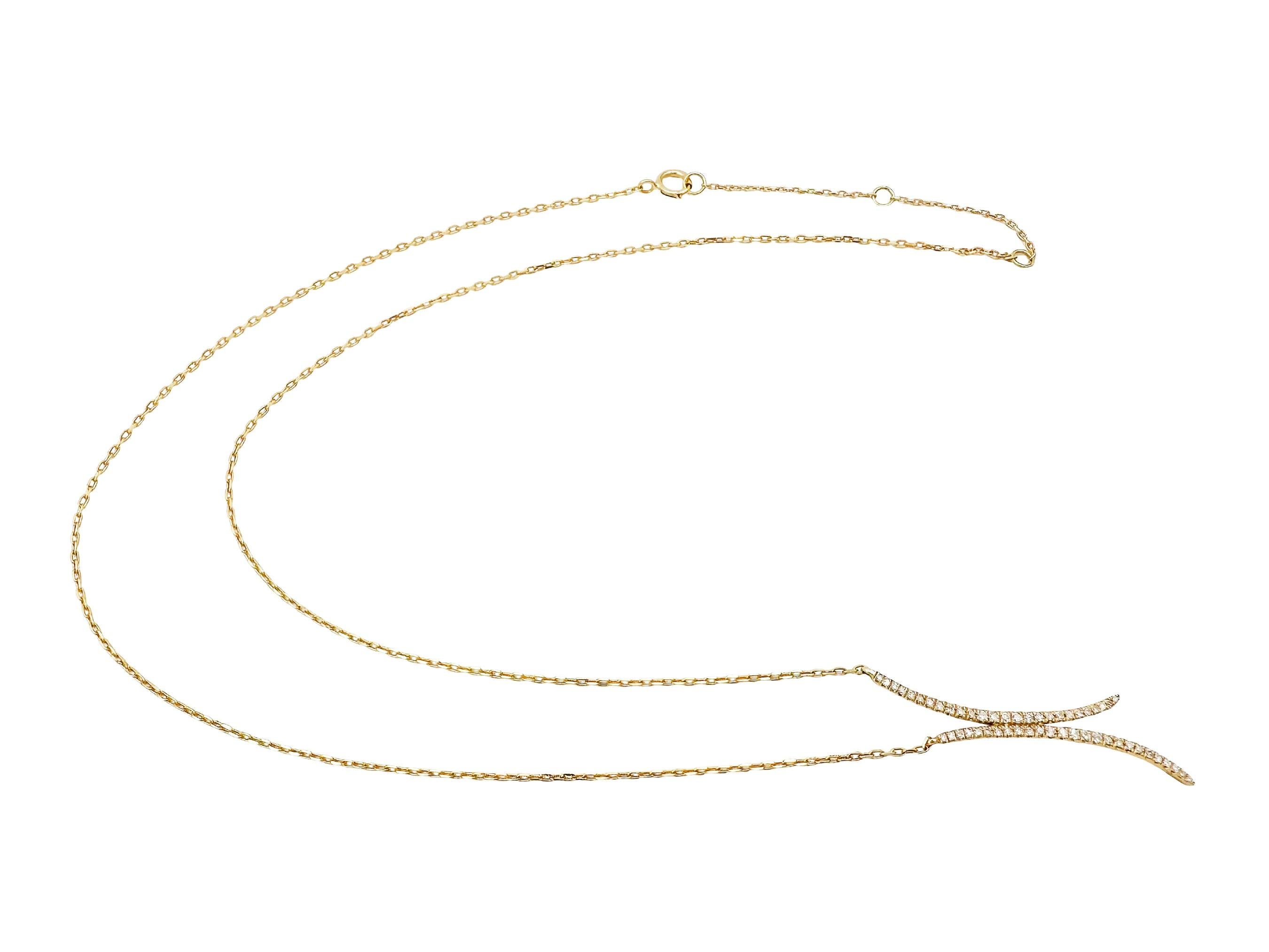 This gorgeous necklace by Casa Reale features a pendant formed of two elongated diamond pavé crescent moons nestled against each other. Set in 14k yellow gold, the pendant gives just the right amount of sparkle to transition perfectly from day to