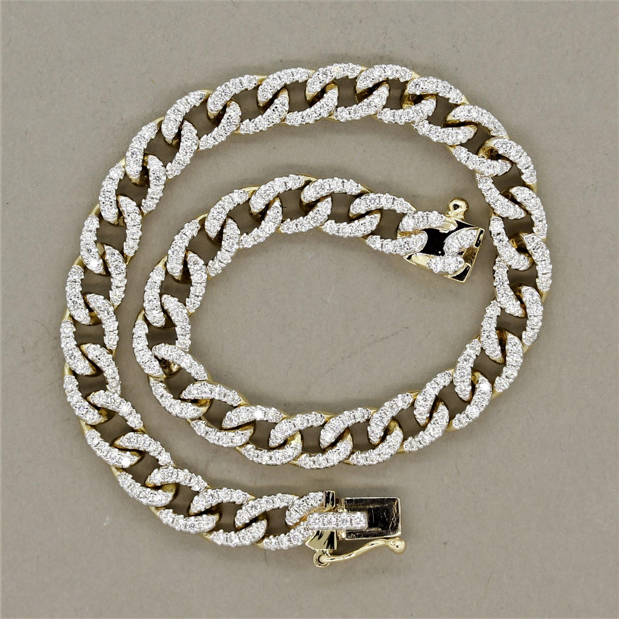 A classic curb link bracelet pave set with 1.90 carats of round brilliant cut diamonds. The bracelet measures 7 inches long and 0.20 inches wide allowing it to be worn on its own or stacked with other bracelets. Hand-fabricated in 14k yellow gold