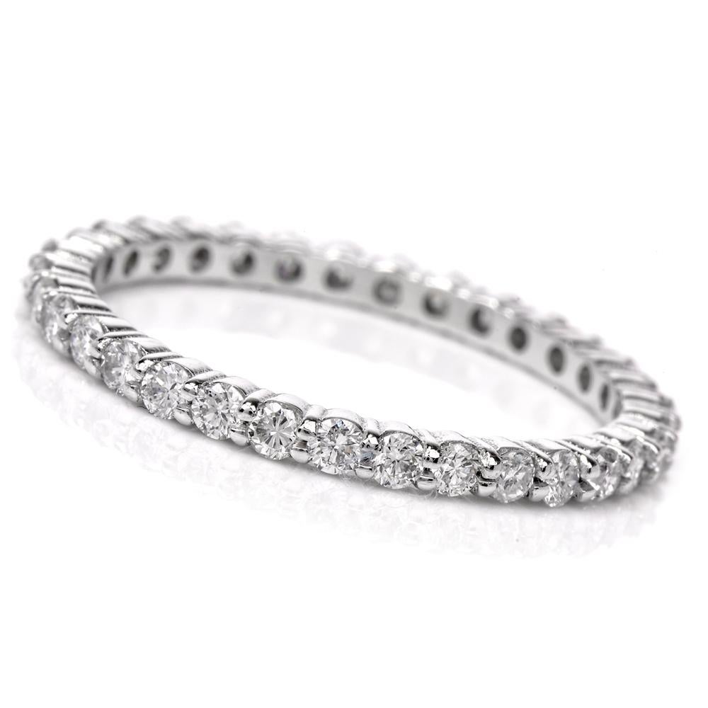 This sparkling diamond eternity band ring is crafted in solid 18k white gold, Pave-set with 33 round-cut diamonds weighing approx. 0.73 carats, graded G-H color, and VS clarity. Ring measures 1mm wide, weighs 2.1 grams, and is a current ring size