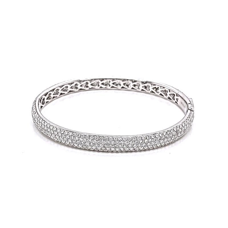 A stunner of a bracelet! This sexy eternity bracelet features 7.30 crats of VS quality round brilliant cut diamonds that cover all angles of this piece. Sparkles and fire jump off the diamonds as the piece is blanketed in bright white diamonds. Set