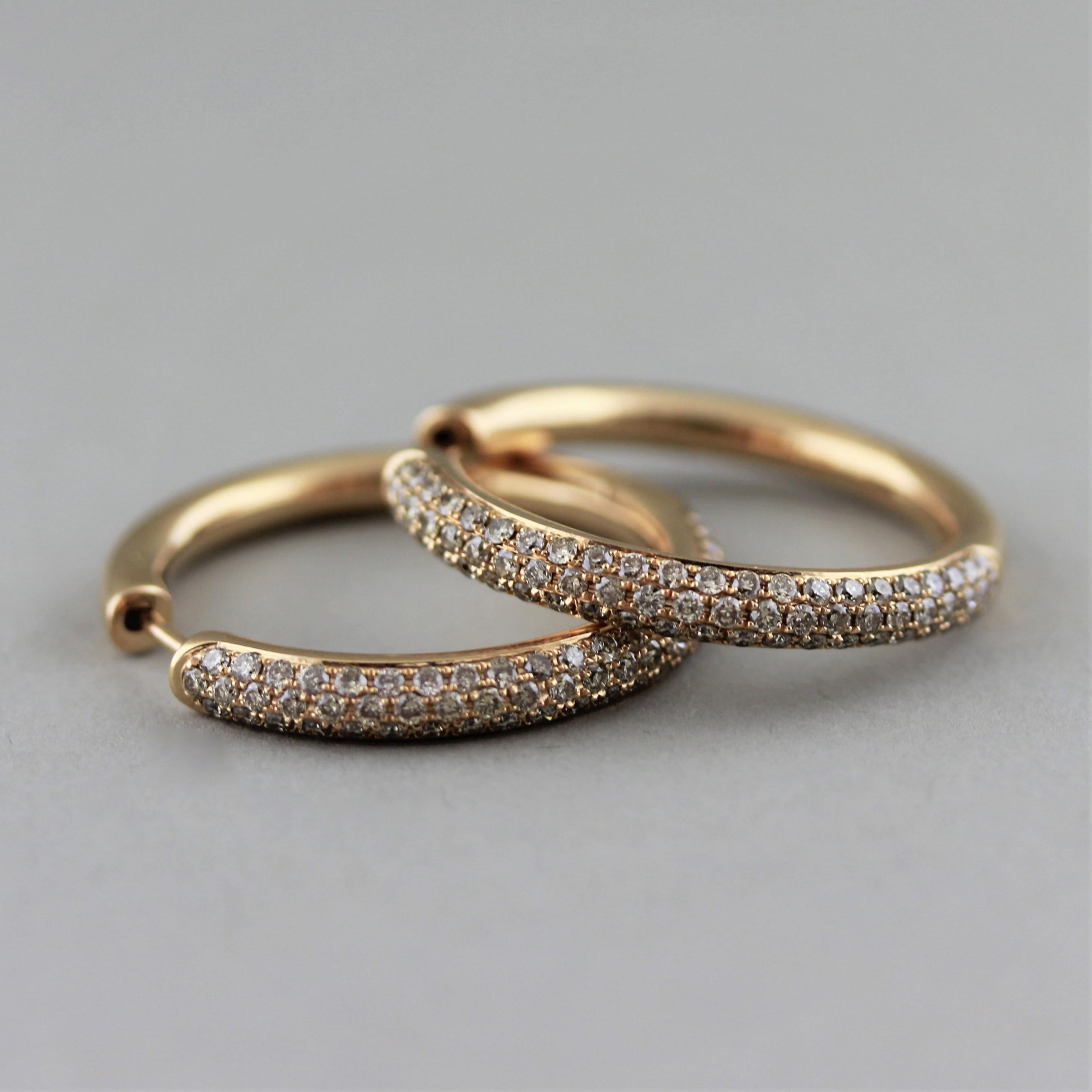 A modern take on the classic hoop earrings! These hoops feature 1.47 carats of fancy colored diamonds pavé set in 18k rose gold. Earrings that can be worn everyday. 


Length: 1 inch
