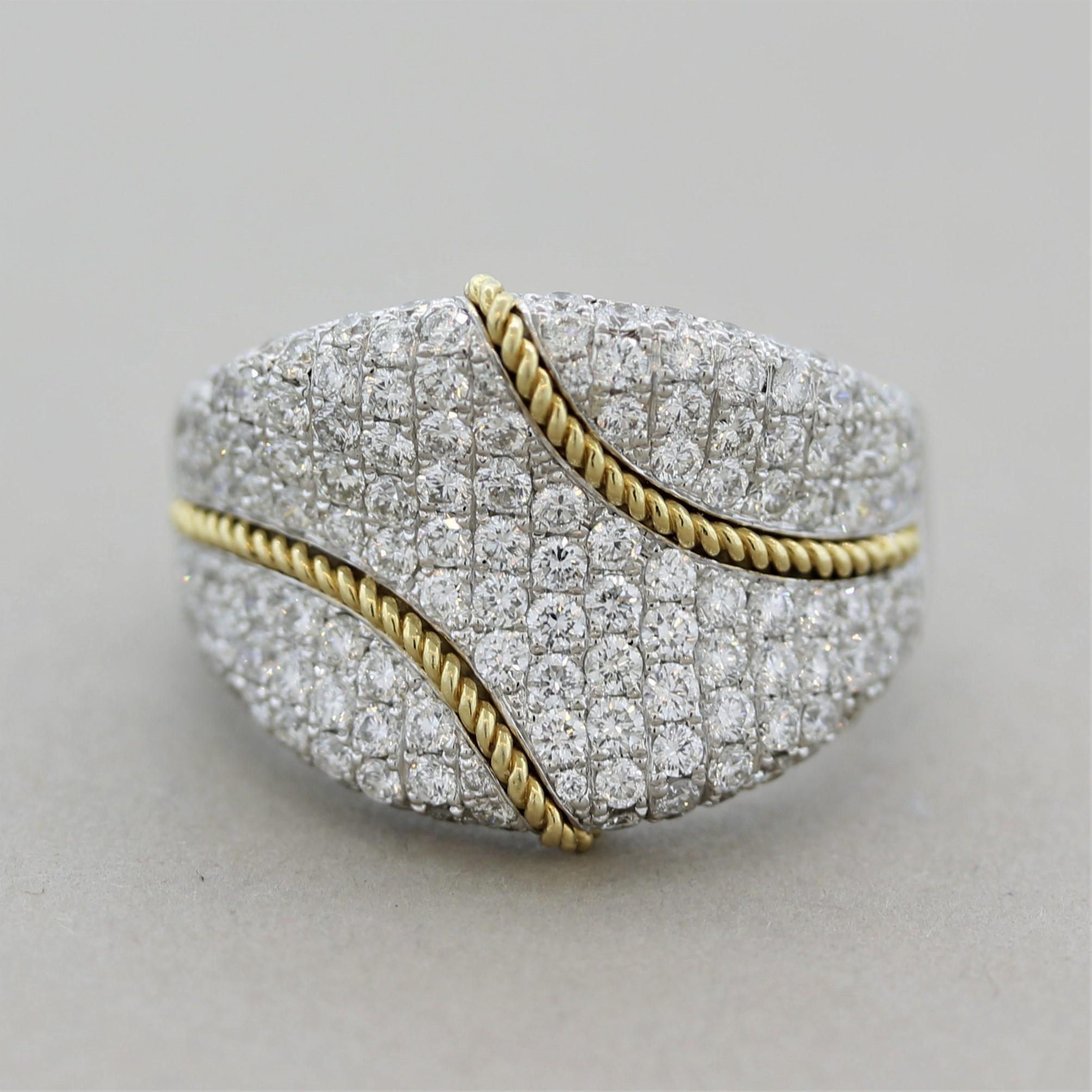 A stylish ring featuring 2.38 carats of fine round brilliant-cut diamonds. Over the blanket of bright white stones are two lines of braided yellow gold adding contrast and color to the piece. Made in 18k gold and ready to be worn!

Ring Size 6.50