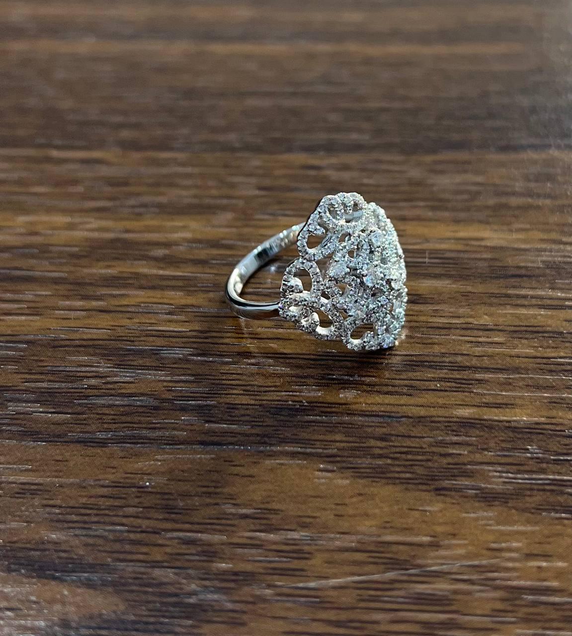 This captivating piece, designed in 14K white gold, features a delicate lattice pattern adorned with approximately 0.51 carats of white diamonds. The intricate openwork design showcases the brilliance of the diamonds, creating a harmonious blend of