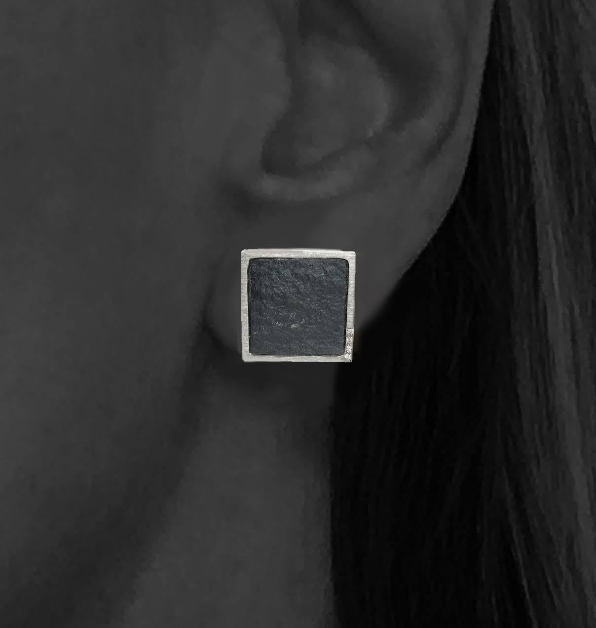 One-of-a-kind. Rough meets refined in these unusual Diamond Pave' in White Gold on Rough Hematite Square Stud Earrings. These scrumptious squares are set in a 14k white gold bezel as stud earrings with a center post and each contain approximately