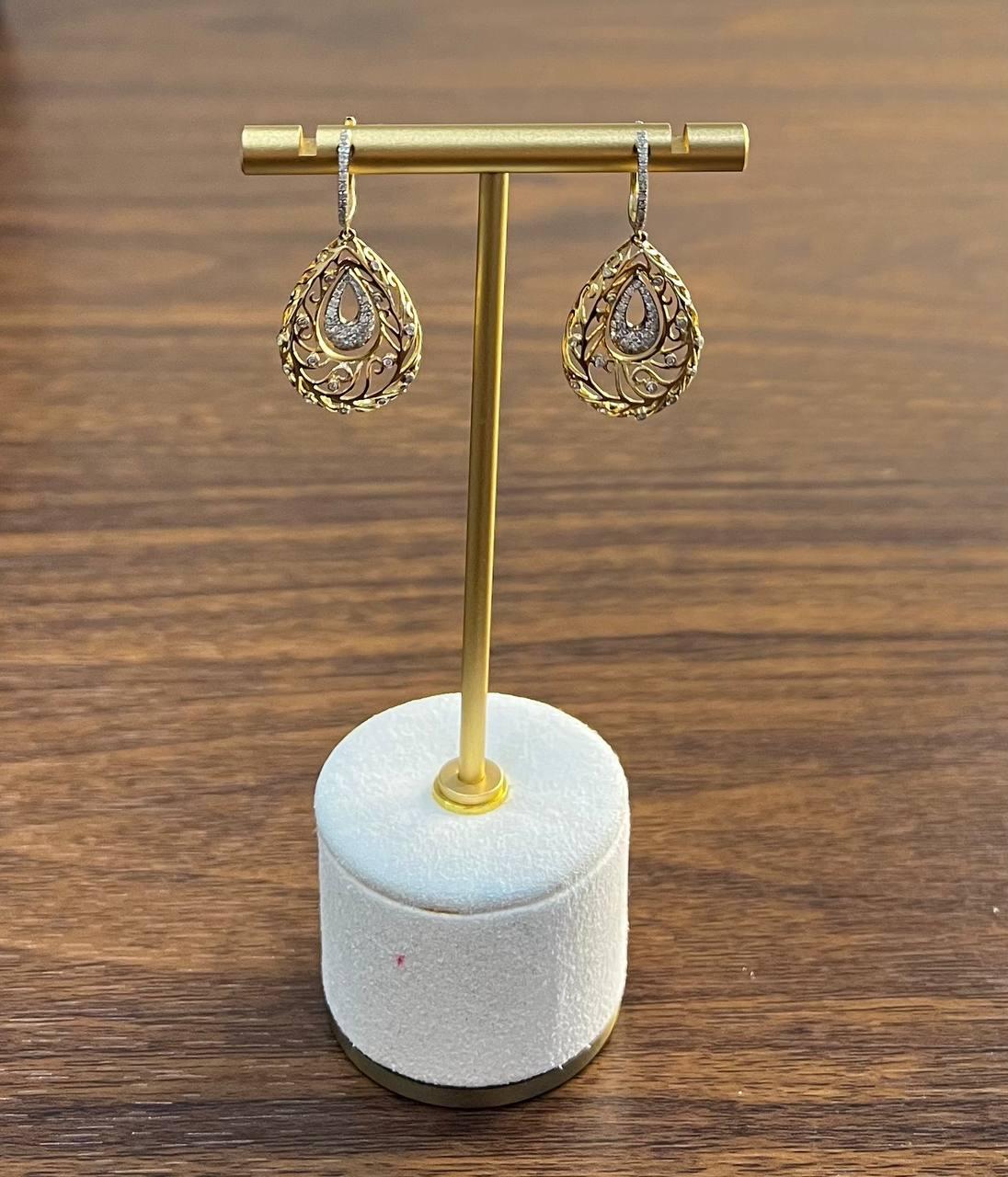 Enhance your elegance with these stunning earrings.
Intricate gold filigree design adorned with shimmering diamonds, creating a captivating allure.
Delicate, ornate, and sophisticated.
0.50 CTW Diamonds
14K Gold