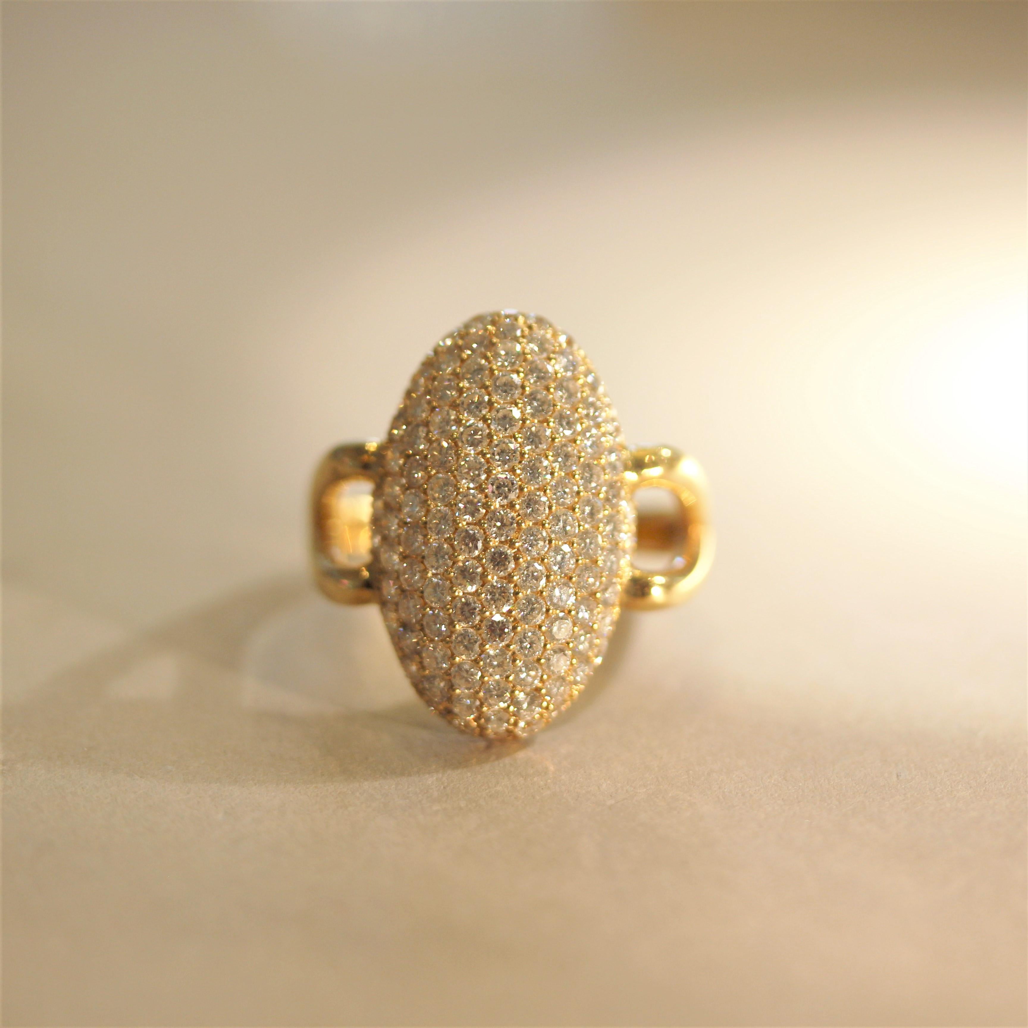 A chic and stylish modern designed ring! It features 2.13 carats of fine round brilliant-cut diamonds which are pave-set over a long-stretched dome gold mounting, in a navette style. This lovely ring is made in 18k yellow gold and can be worn