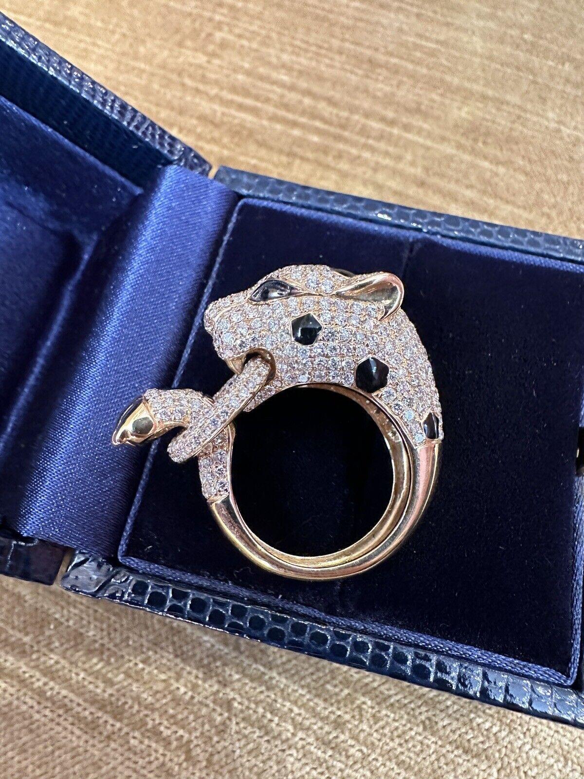 Diamond Pavé Panther Ring 3.51 carat total weight in 18k Yellow Gold 

Panther Ring features a Spotted Panther design decorated with 3.51 carats of Round Brilliant Diamonds and black enamel spots, with a Pavé set Diamond Link in the mouth and paw,