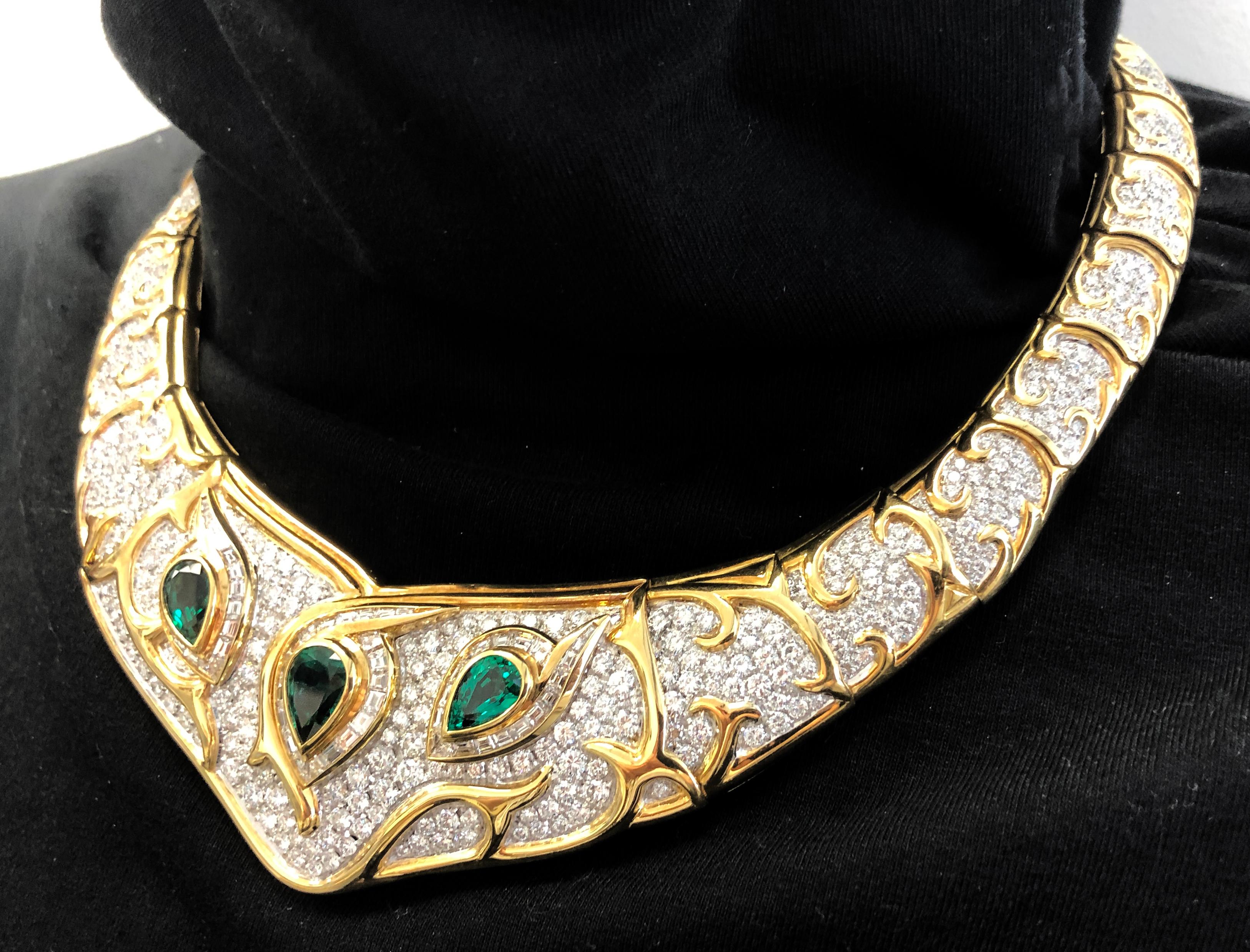 Diamond Pave Pear Emerald Bib Necklace in 18k Two-Toned Gold.
A diamond-encrusted bib necklace contrasted with organic patterns of yellow gold, and three brilliant pear-shaped diamonds. The emeralds are a vibrant deep green, surrounded by