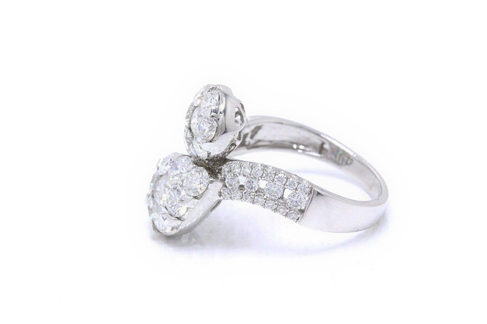 DIAMOND PAVE COCKTAIL RING
Style:  Twist
Metal:  18KT White Gold
Size:  7 - Sizable
Width:  2 MM - 18 MM
Total Carat Weight:  2.11 TCW
Diamond Shape:  60 Round Diamonds
Diamond Color & Clarity:  F / VS
Hallmark:  G18K 750 d2.11
Includes:  Elegant