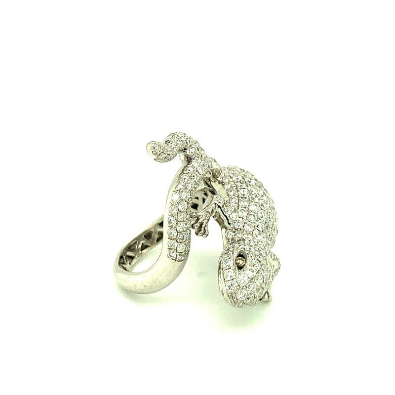 One diamond pave salamander 18K white gold ring featuring round brilliant cut diamonds totaling 2.82 ct. including two champagne color diamonds set as the salamander’s eyes. The ring wraps around the finger beautifully and comfortably. Daring,
