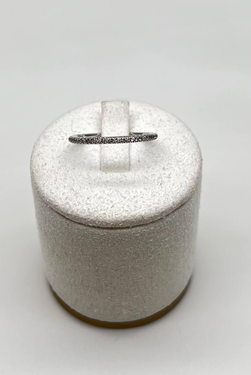 This elegant ring is crafted in 14K white gold. It features a delicate band adorned with a row of sparkling white diamonds. The diamonds are of G color grade. The total diamond carat weight is 0.29.