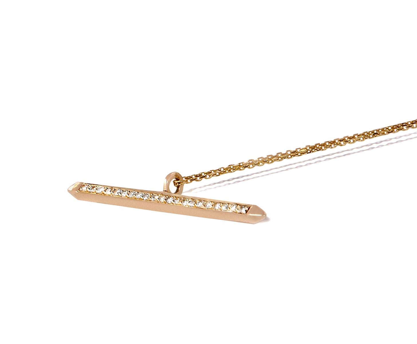 This spear-shaped solid gold pendant is crafted in 9-carat yellow gold accented with 21 white diamonds and strung on a fine 16-inch gold chain. The total diamond carat weight is 0.17 carats of H/VS1 quality diamonds and the pendant is 2mm in width