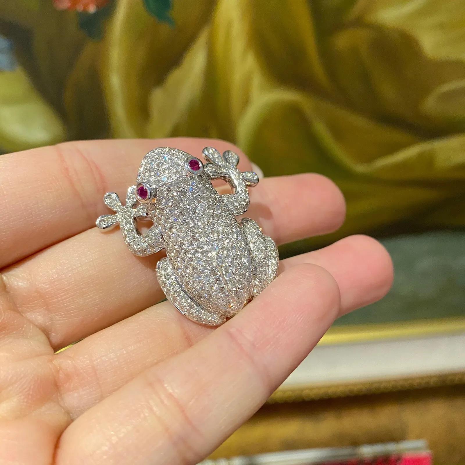 Diamond Pave Tree Frog Pin Brooch in 18k White Gold

Diamond Frog Pin features 3.77 carats of pave set Round Brilliant Diamonds with two Ruby eyes, all set in 18k White Gold.

Total diamond weight is 3.77 carats.
Total Ruby weight is 0.10