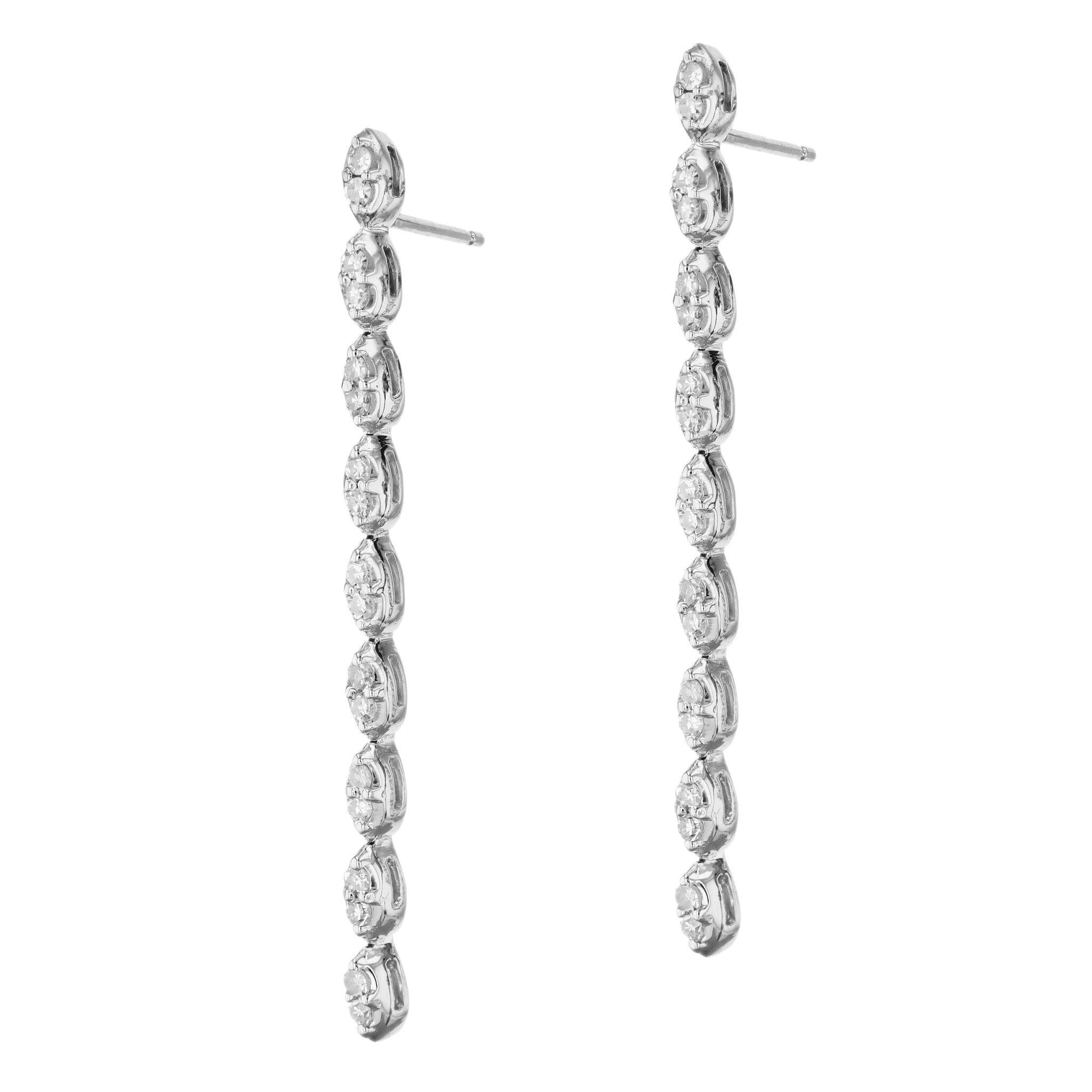 Glimmering in 14kt white gold and encrusted with 36 single cut diamonds, these Diamond Pave White Gold Estate Drop Earrings evoke joy and opulence. An Estate Collection standout, these earrings are the perfect way to add a vivid sparkle to any
