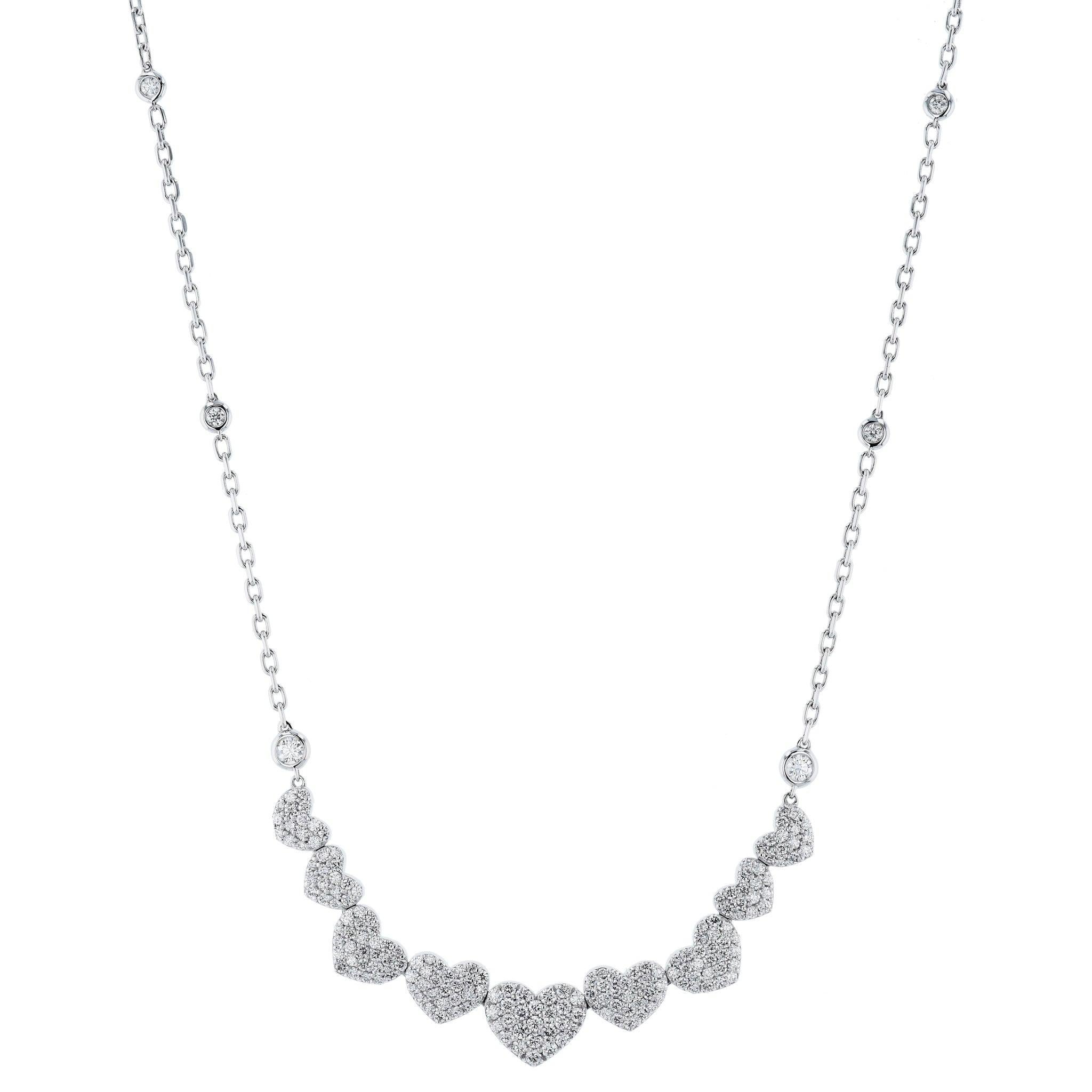 This luxuriously crafted Diamond Pave White Gold Heart Necklace Necklace is made with 14 Karat white gold and Diamond Pave Hearts. It is so beautifully eloquent.  
This necklace is perfect for any one that loves hearts. 
This easy to wear necklace