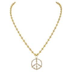 Collier à pendentif de paix en or jaune 14 ct.