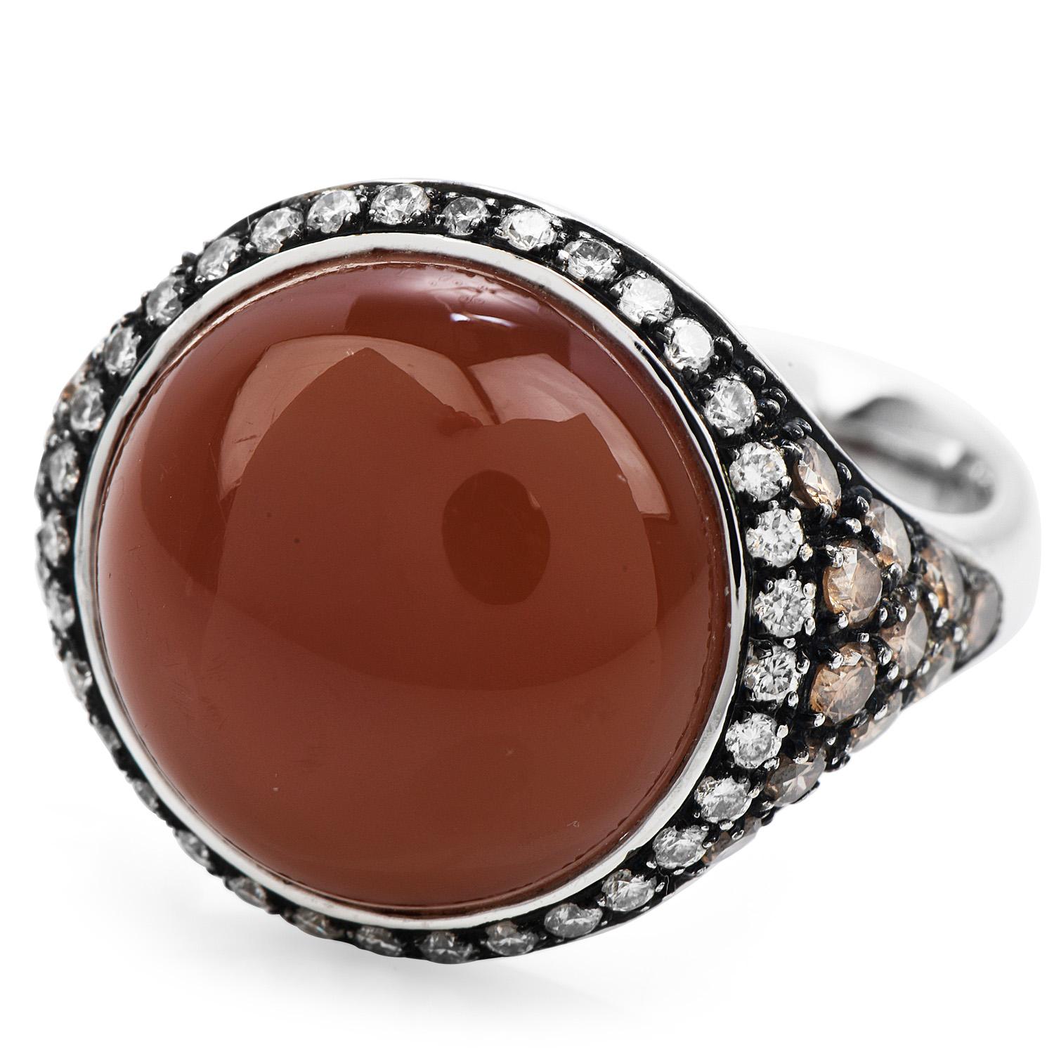 This is an exquisite Diamond, Fancy Brown, and Peach Moonstone Elegant Cocktail Ring with a total weight of 10.0 grams.

Crafted in solid heavy 18K white gold, the center is adorned by a unique Genuine Peach Moonstone measuring approx 14 mm x 14 mm