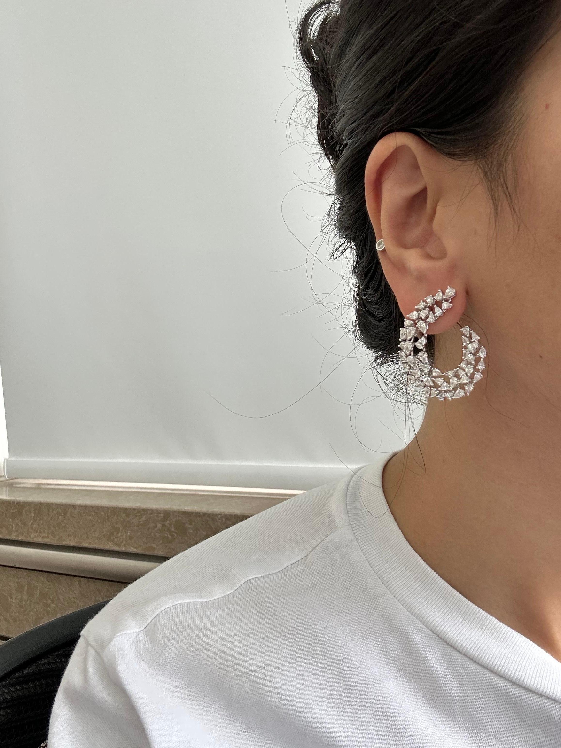 A beautiful pair of statement Diamond earrings, with all pear shapes - H/I VVS/VS quality. Set in solid 18K White Gold. Comes with omega clips and push-pull backing. 