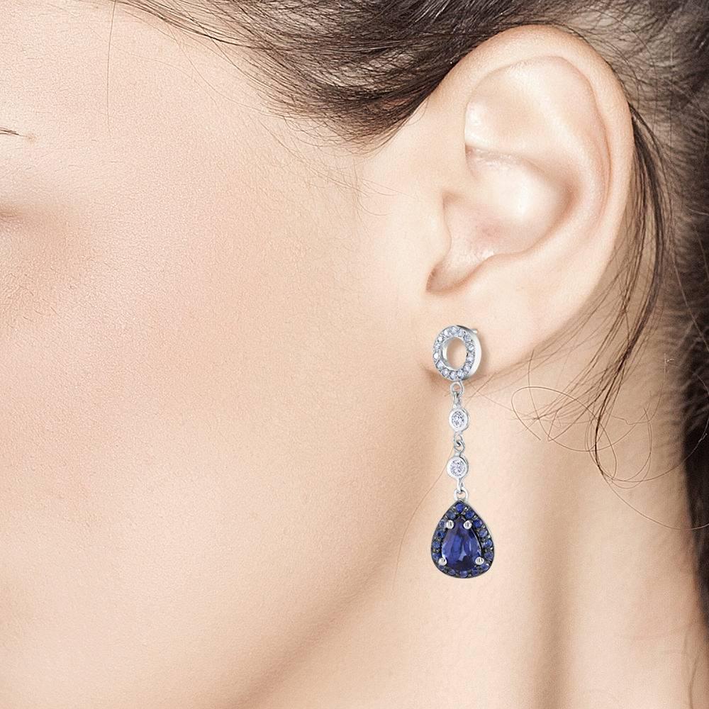 Featuring 18k white gold diamond circles and halo sapphire drops earrings 
Pear shape Sapphire weight 2.40 carat 
Diamond weight  0.60 carat
New Earrings
Our team of graduate gemologists carefully hand-select every diamond and gemstone, while our