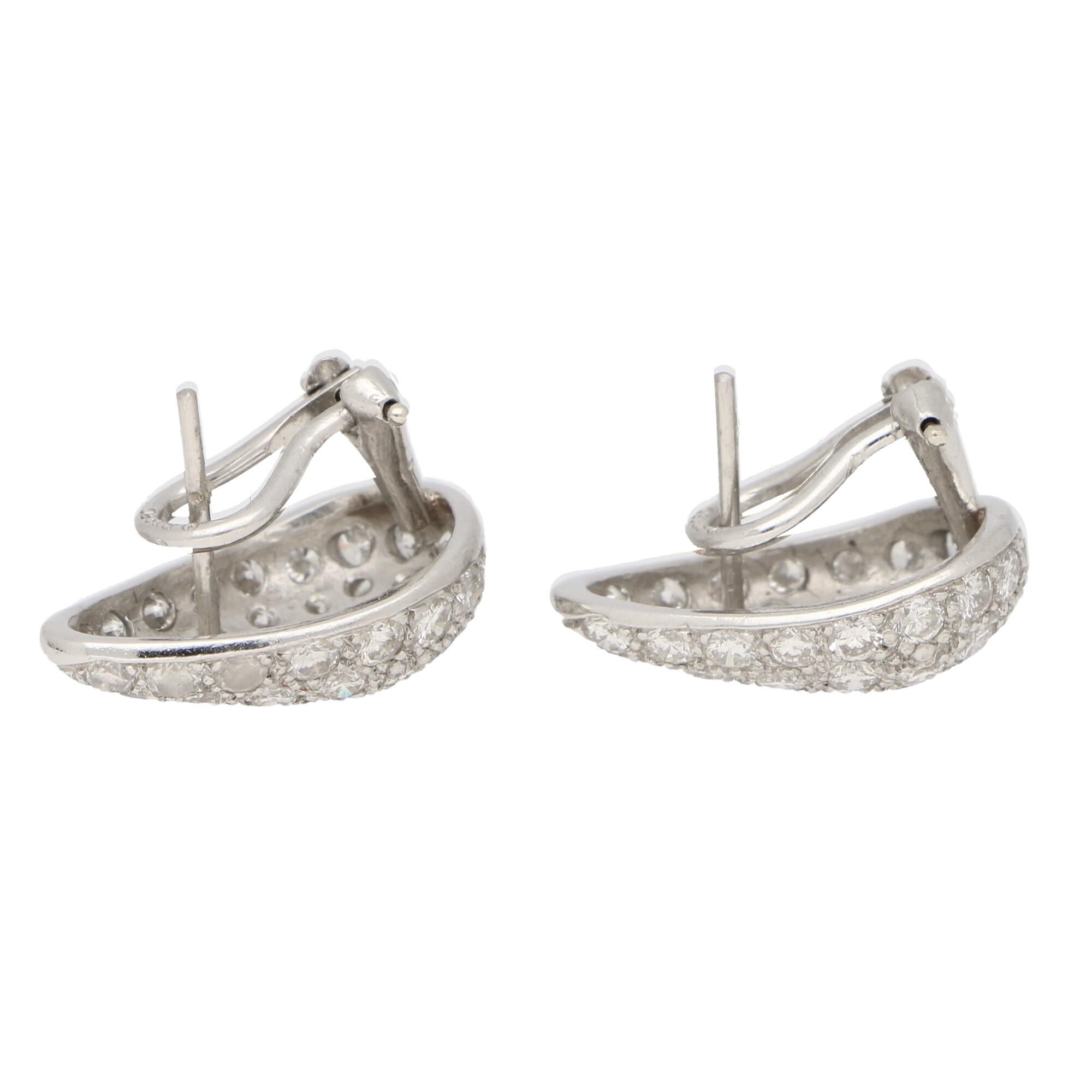 Round Cut Diamond Pear Shaped Earrings Set in Platinum For Sale