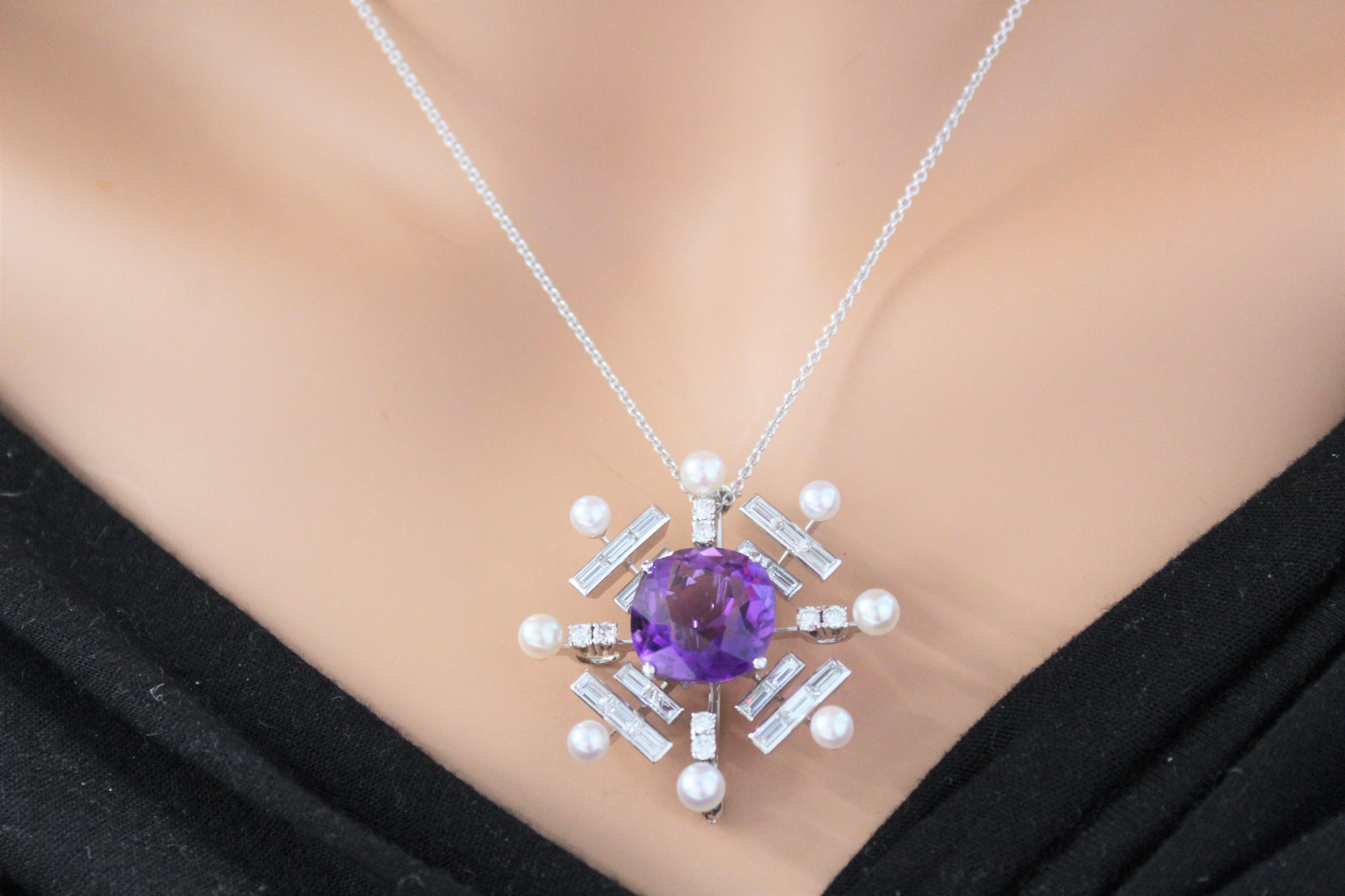This gorgeous diamond pendant is set in 18K white gold. The total diamond weight of this piece is 2.10 carat total weight. The center stone is an Amethyst gemstone that weighs 10 carats. A pendant like this is the perfect way to tell your lovely