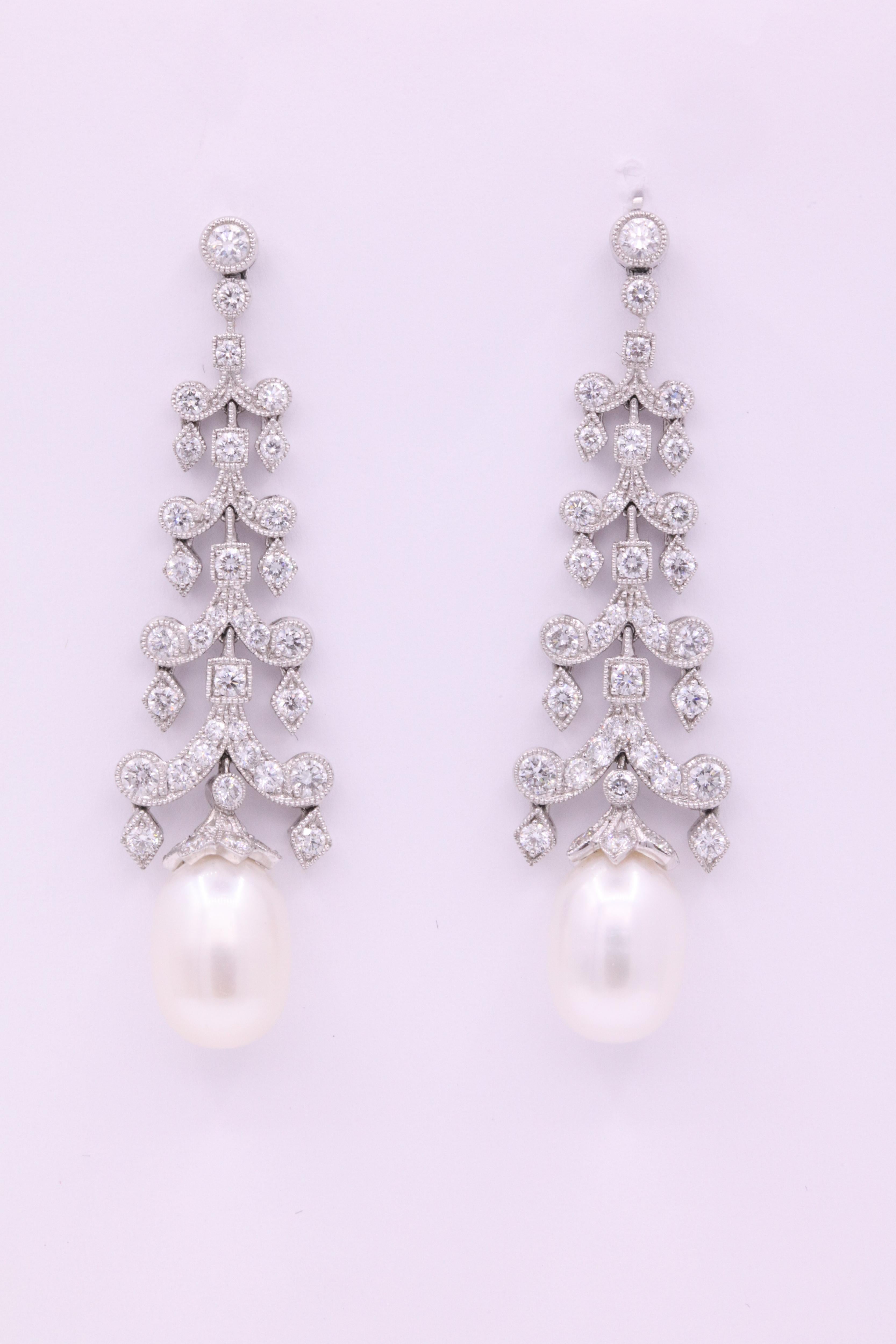 Art Deco style earrings featuring round brilliants weighing 3.10 carats and a white oval shape pearl, crafted in platinum. 
Color G
Clarity SI