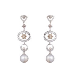 Orecchino con diamante e perla in oro 18 carati