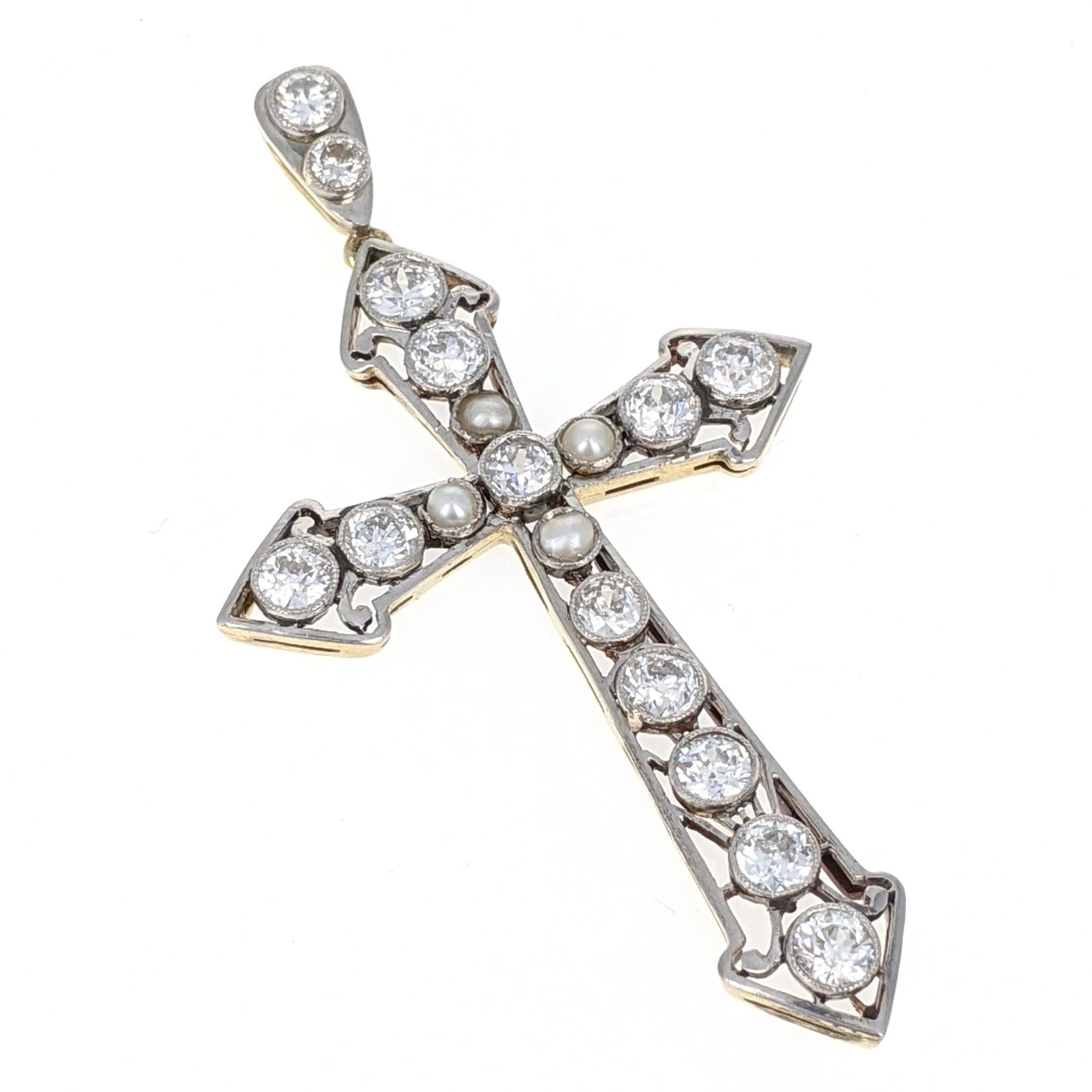 This cross pendant features four pearls and 14 Old-European cut diamonds weighing approximately 2 carats total. Mounted in platinum and yellow gold. Measures 2.25