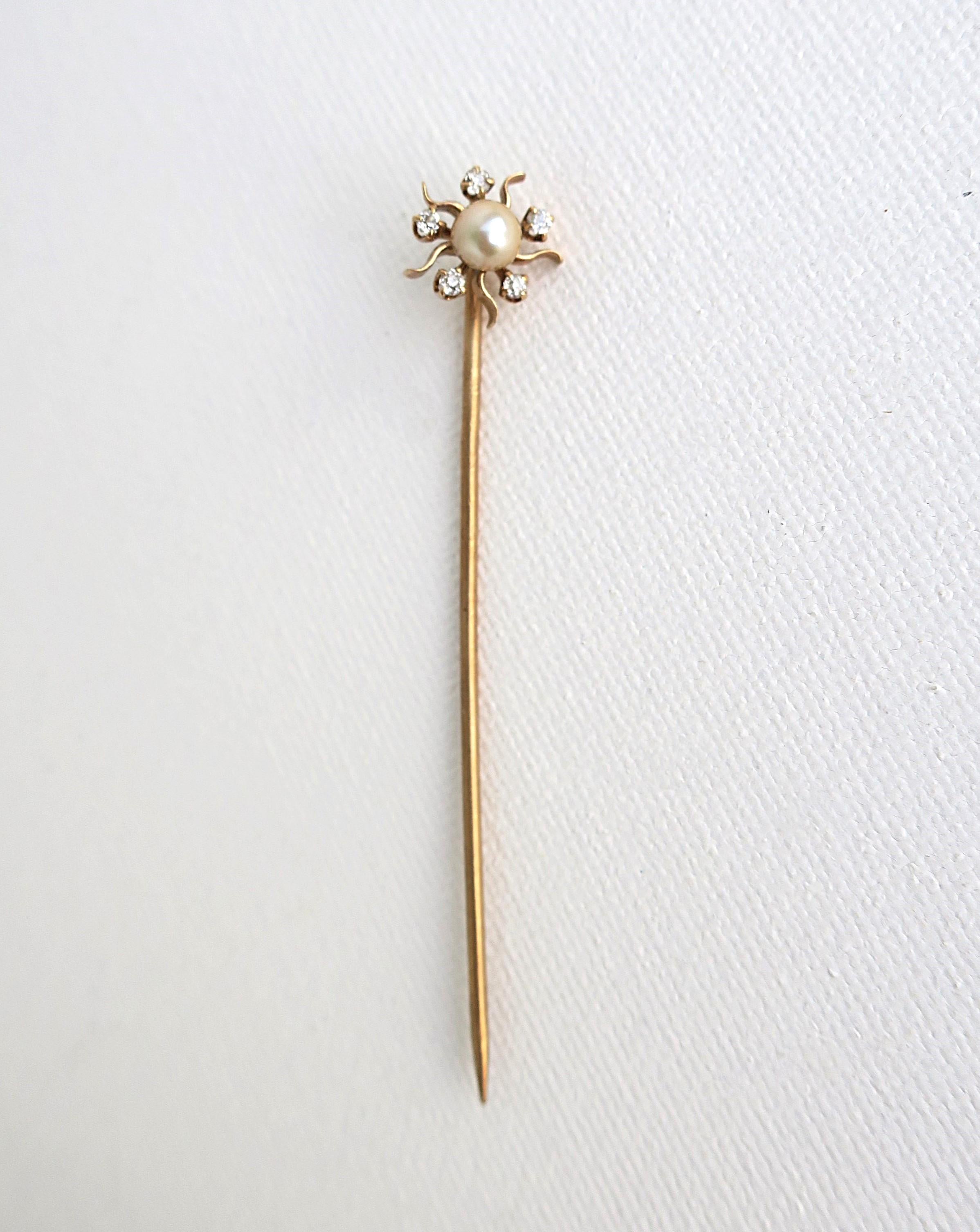 A beautiful diamond, cultured pearl, and 14-karat yellow gold stickpin brooch, circa early-20th century. A beautiful stickpin brooch with five (5) round genuine old mine cut diamonds and a cultured pearl with high luster at center, depicting a
