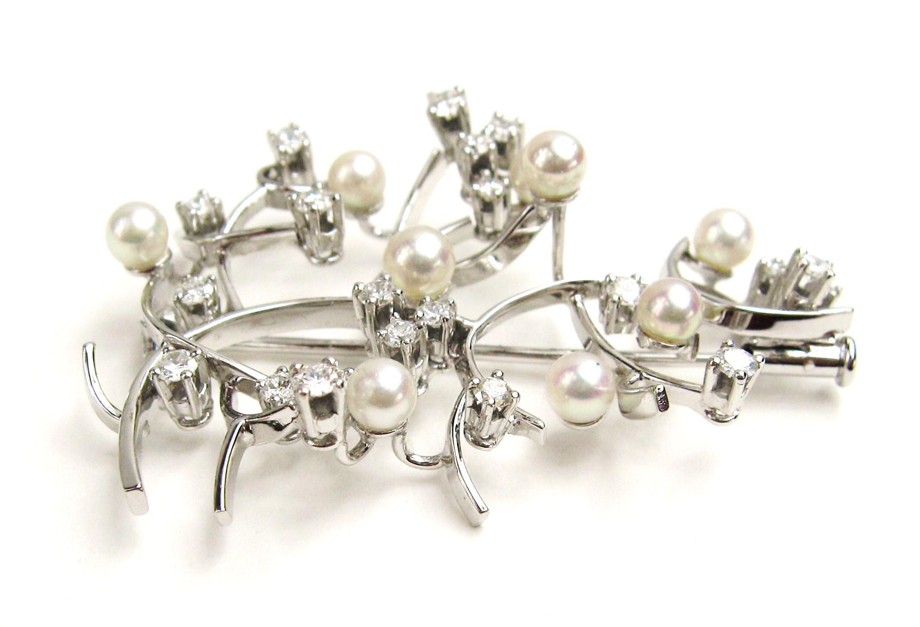 Diamond and Pearl Spray Brooch set in 18K White Gold Hallmarked. Featuring 9 Round Cultured Pearls Measuring 3.7 mm Accented By 23 Round Brilliant Cut Diamonds. Stunning quality prong set diamonds. Be sure to check our store front for more fabulous