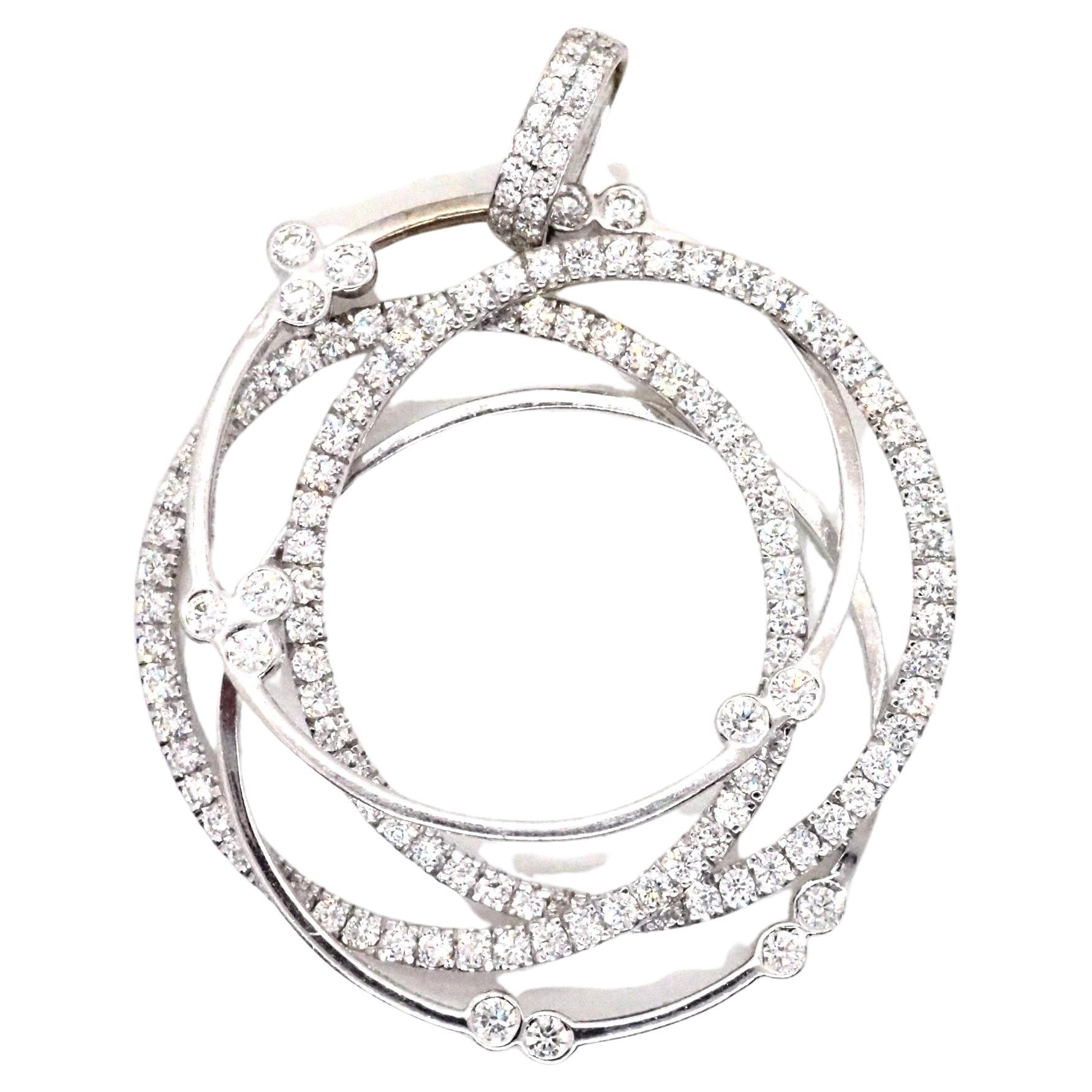 Sublime quadruple halo pendant made of 18 karats white gold, two of the halos are paved with 106 round shape diamonds, the other two rings have a total of 14 diamonds, and the pendant there are ten more diamonds, an approximate weight of the