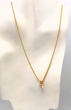 Diamond Pendant and 14 Karat Yellow Gold Rope Chain