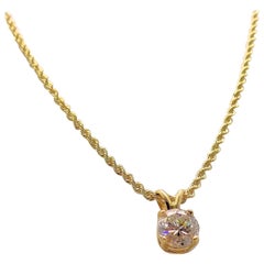 Diamond Pendant and 14 Karat Yellow Gold Rope Chain